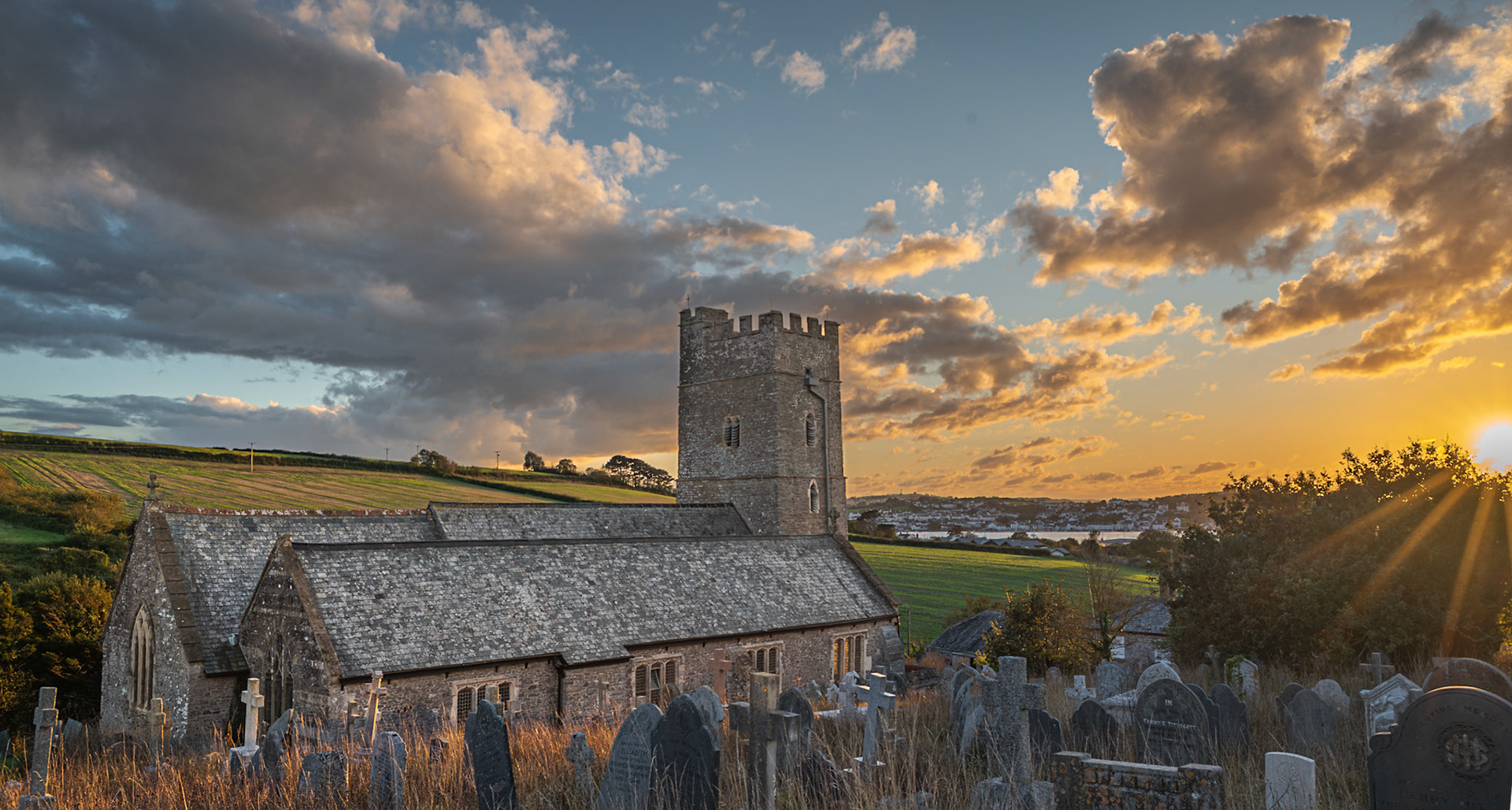 Sun setting over Instow church