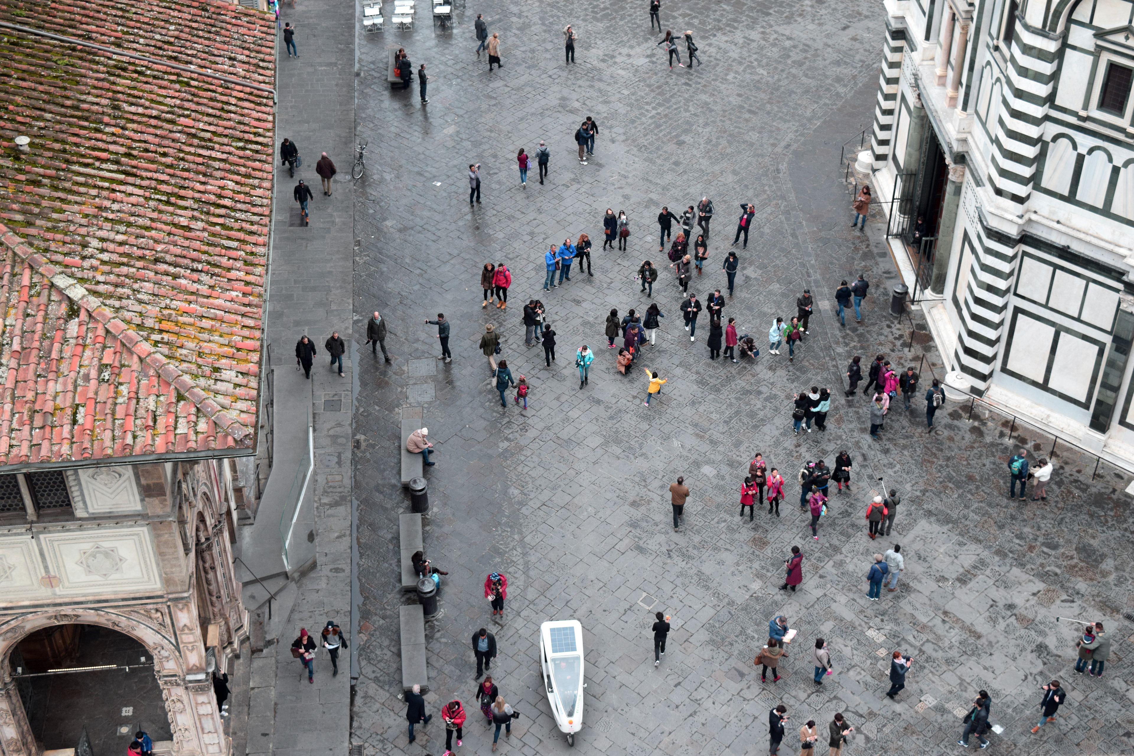 “There are so many people constantly moving through Florence: tourists, students, immigrants. You can never build a constant support system because we’re all moving around so much. One day your friends stop showing up at the local coffee bar and you never see them again. It happens a lot. One day I’ll leave, too. That’s how it works.” (Within Campanile di Giotto, looking down on Piazza del Duomo, Florence, Italy)