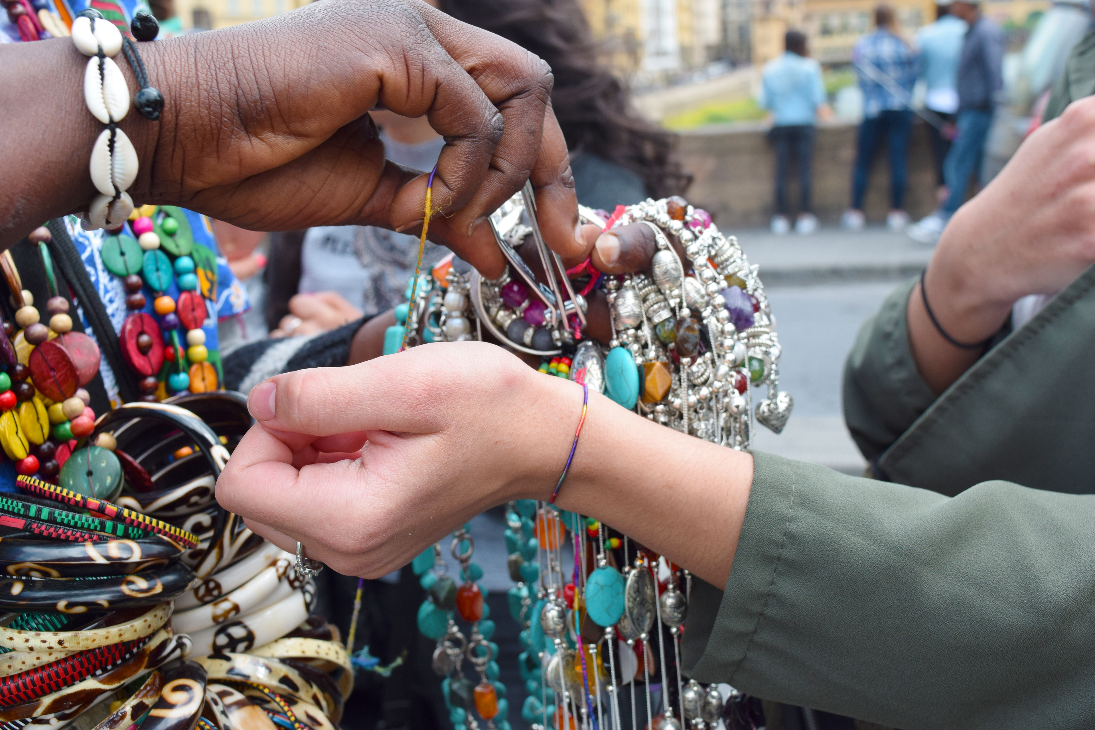 “I will do this until the day I leave this cruel Earth if it means my boys can live better lives. Even if I have to walk this bridge ten thousand more times, if it means my boys don’t have to live in fear, I will do it. What mother wouldn’t?” (Ava cutting bracelets on Ponte Santa Trinita, Florence, Italy)
