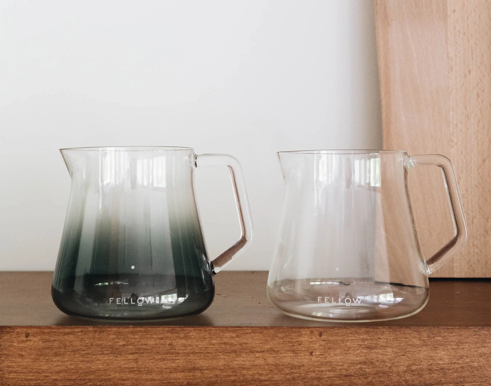 Fellow carafes. Smoked grey next to clear glass