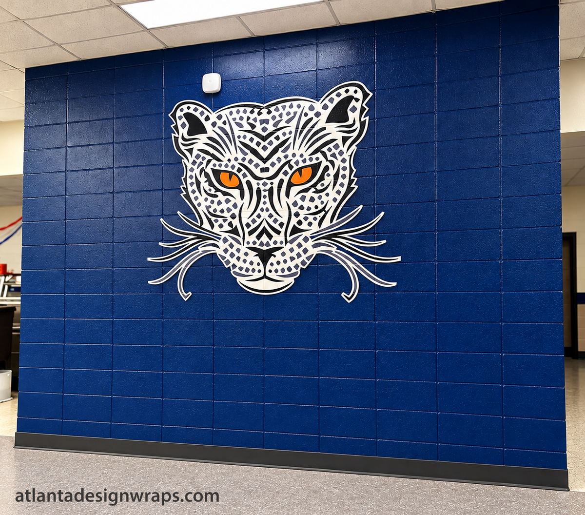 Custom school wall graphics in Atlanta featuring a large wildcat mascot design for campus branding and student spaces.