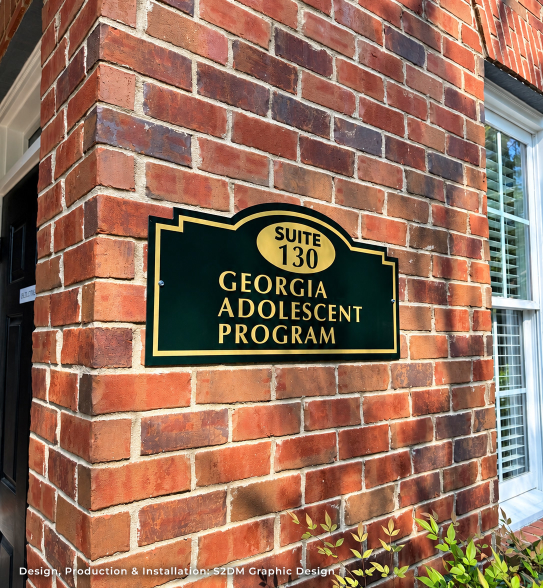 Custom contour-cut aluminum business sign installed on a brick office building in Metro Atlanta for Georgia Adolescent Program Suite 130.