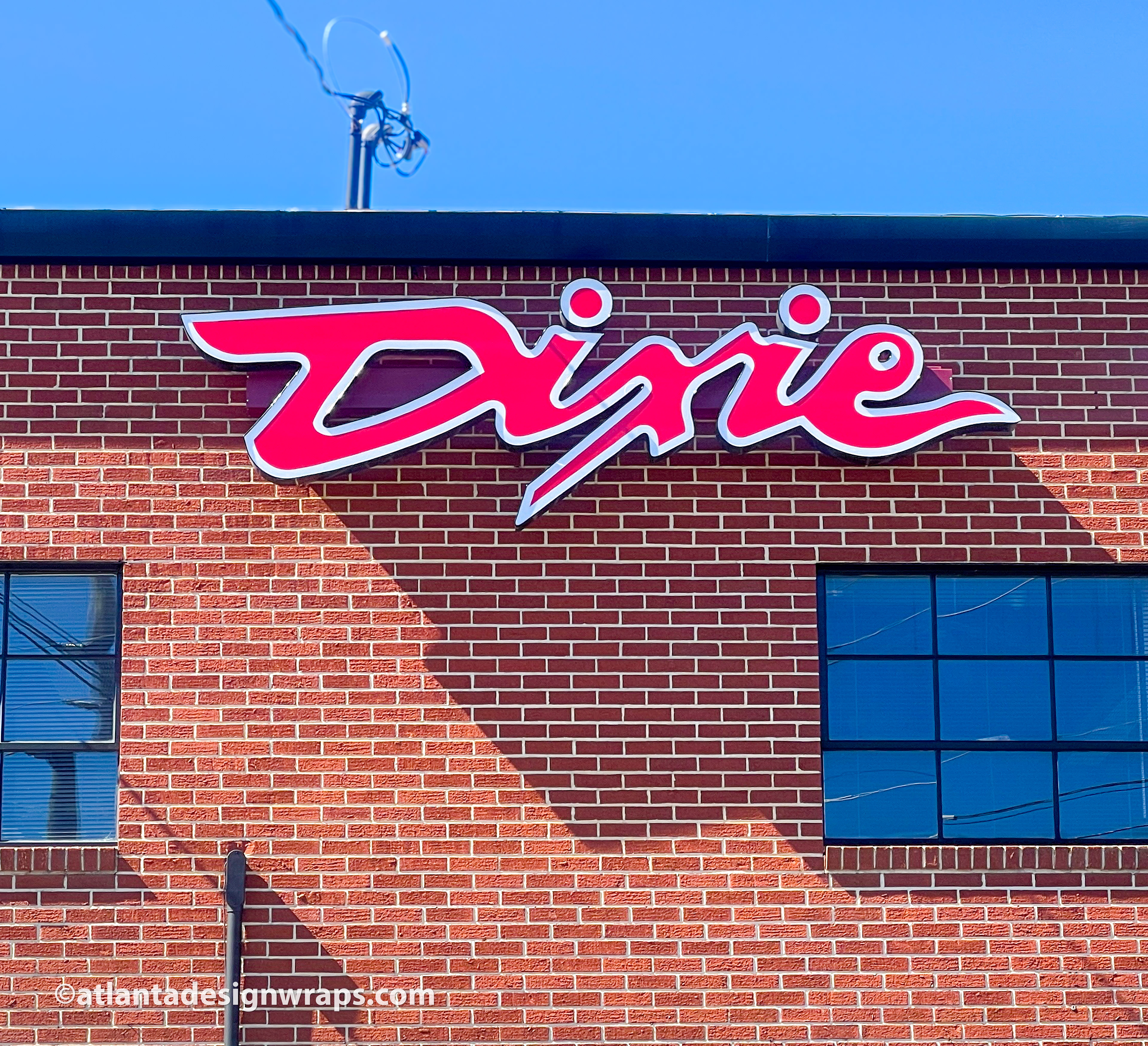Hero image: Atlanta Signs. Dixie Exterminators Marietta front store sign remodel: LED upgrade and facade vinyl by S2DM Design Agency in Atlanta.