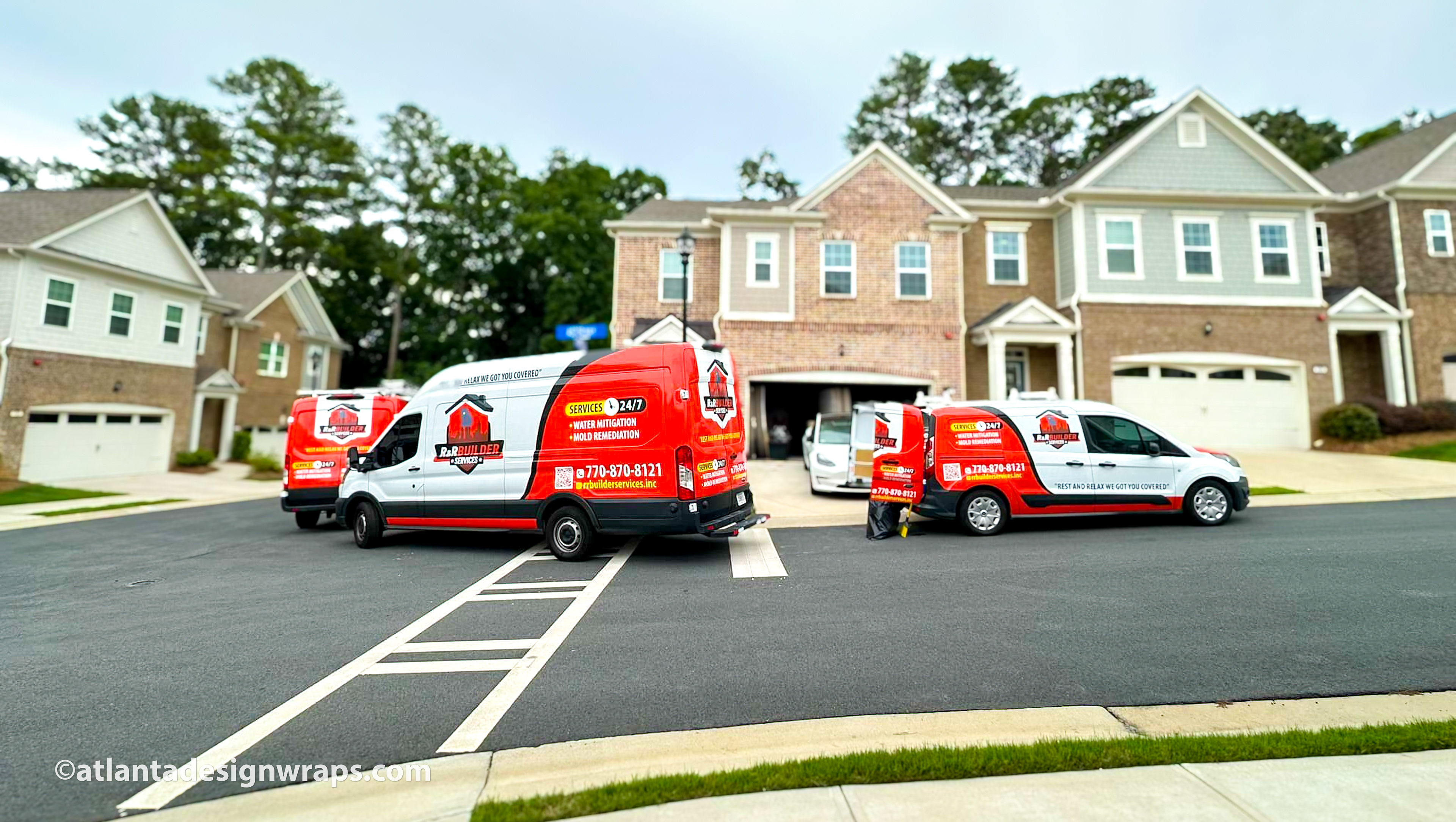 Hero image: R&R Builder Services fleet of white trucks with partial wraps at a Lawrenceville job site.