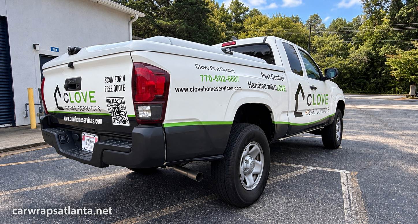 Rear Toyota Tacoma commercial vehicle graphics with QR code