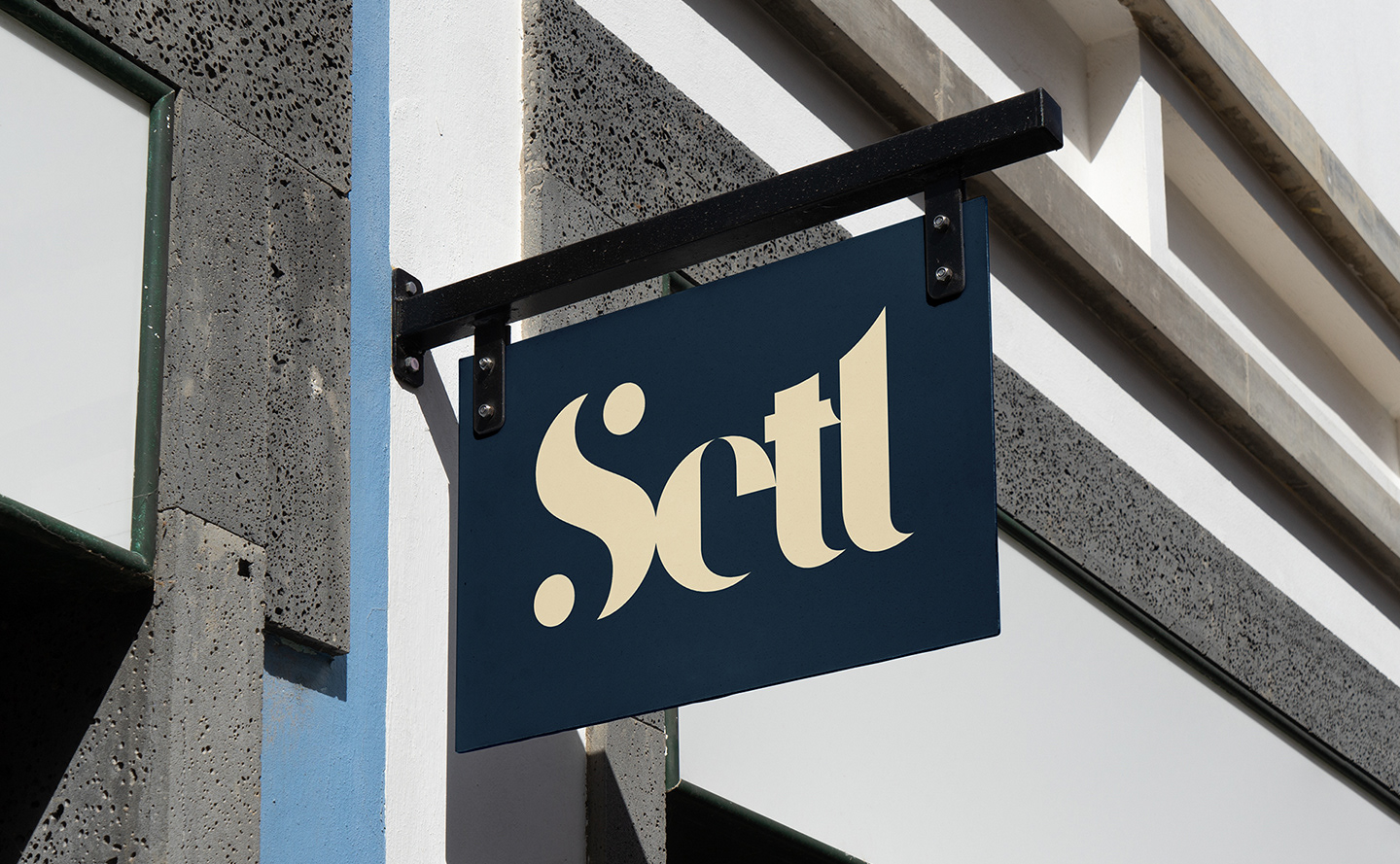 The Setl logo printed on a hanging side outside of a building