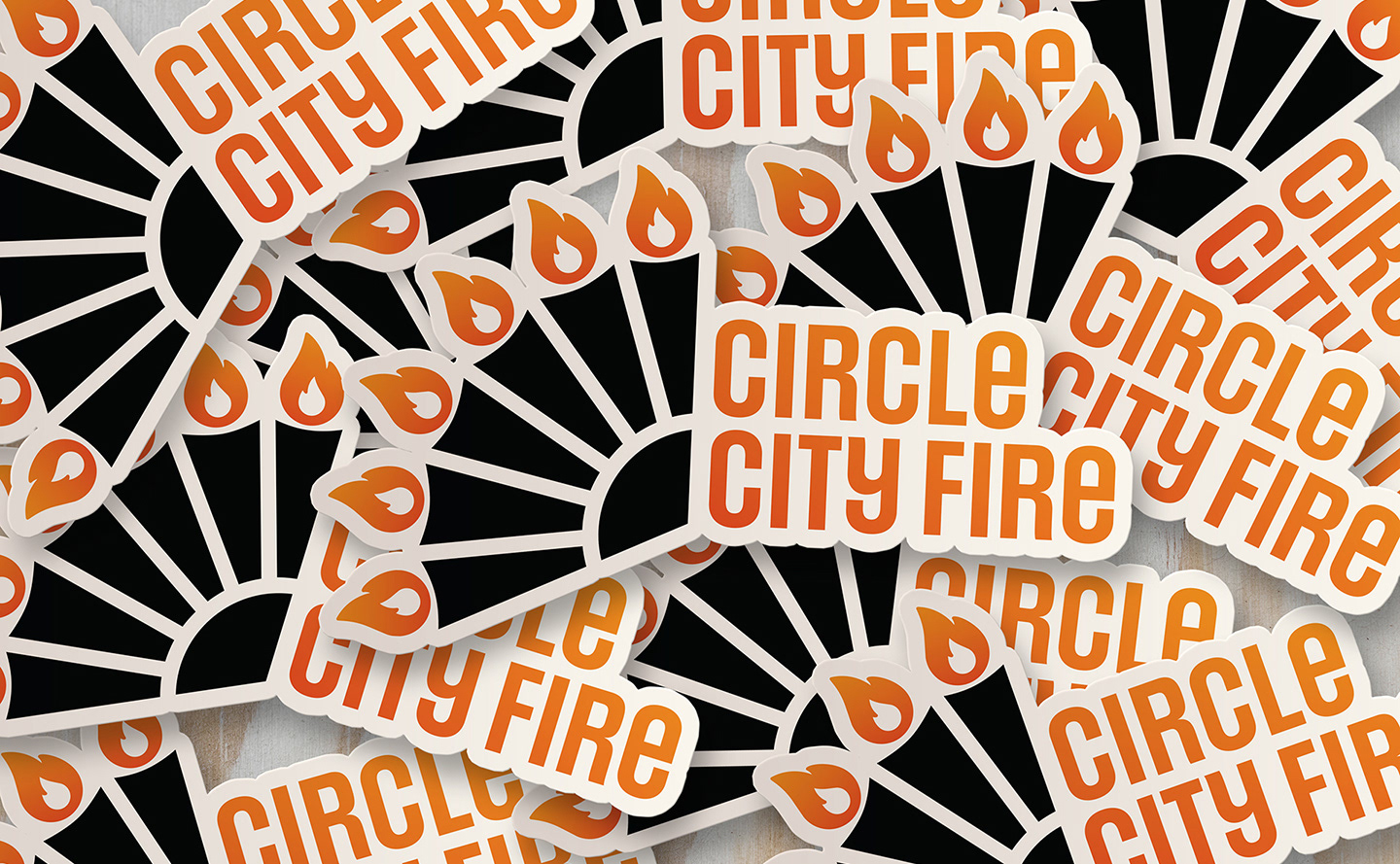 A stack of die cut stickers of the Circle City Fire logo