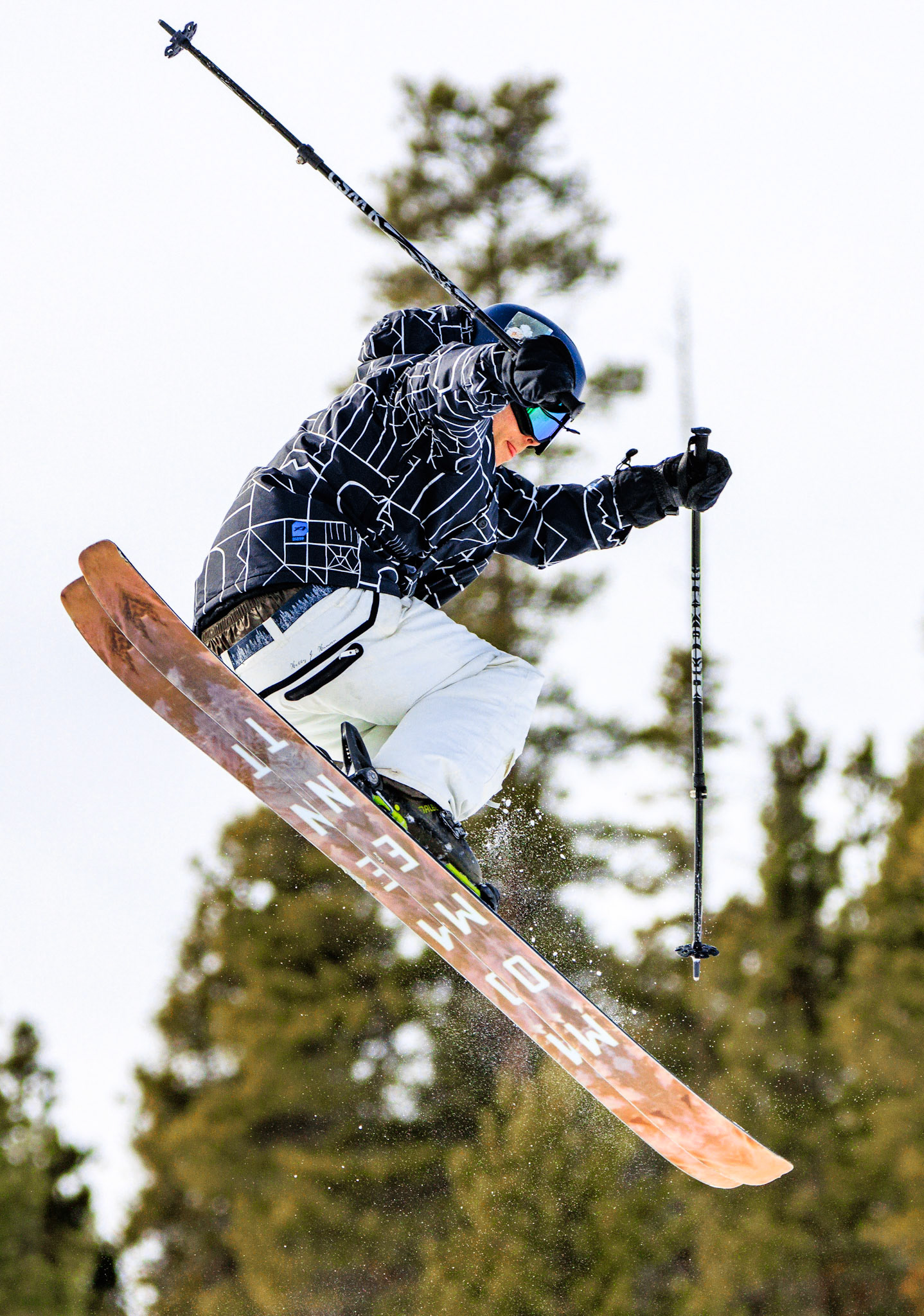Ben Mosier attempts a 180 at the Snowy Range Ski Resort in Medicine Bow National Park, WY, Saturday, February 11, 2023. In addition to performing tricks during his free time, Mosier juggles grooming the slopes, studying mechanical engineering, and teaching skiing lessons.