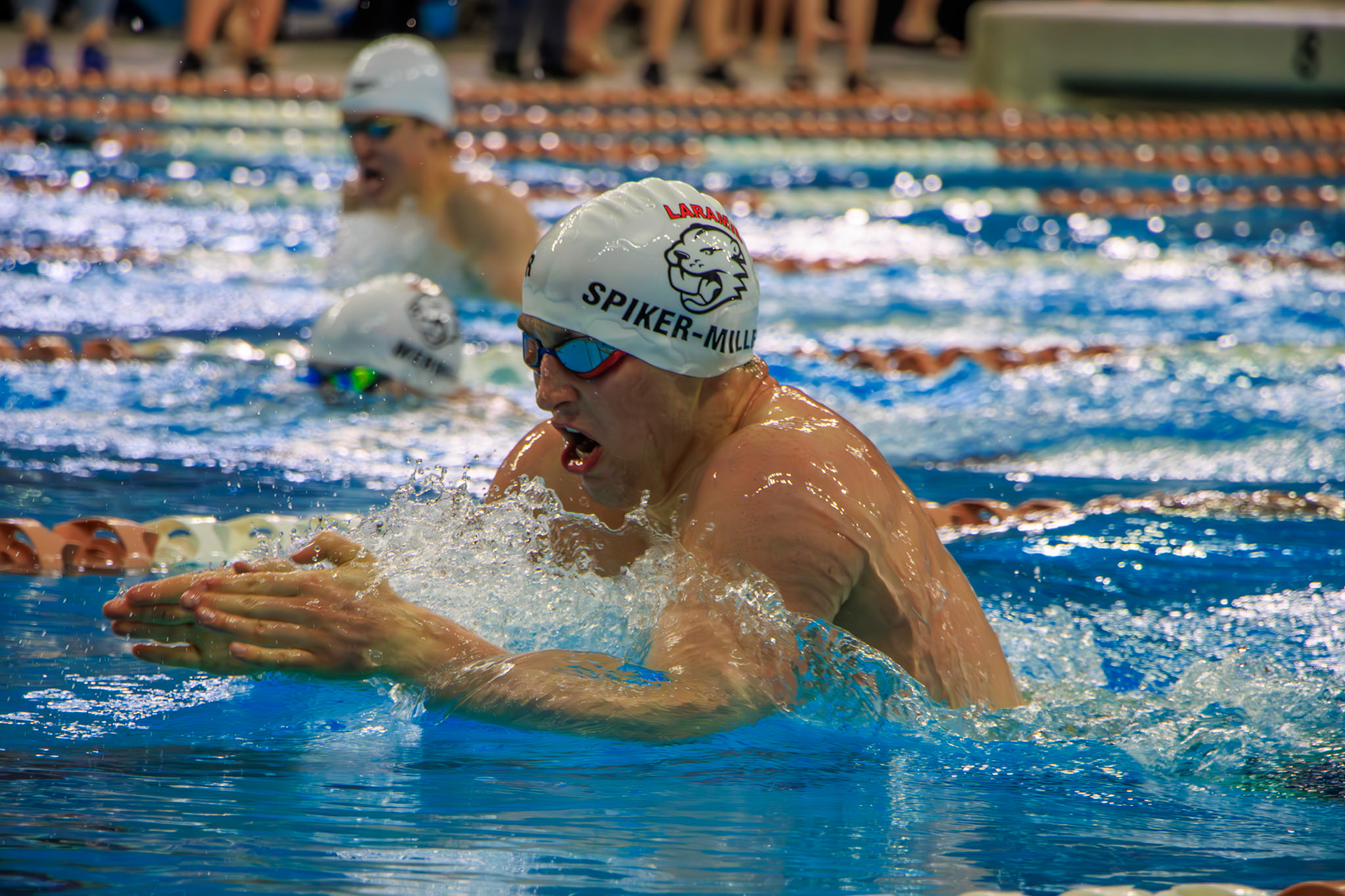 Mace Spiker-Miller swims the breaststroke portion of the 200 IM, aiming to maintain his lead over his teammate in the adjacent lane at the Four Corners Sectionals Swim Meet in Austin, TX, Sunday, March 26, 2023.