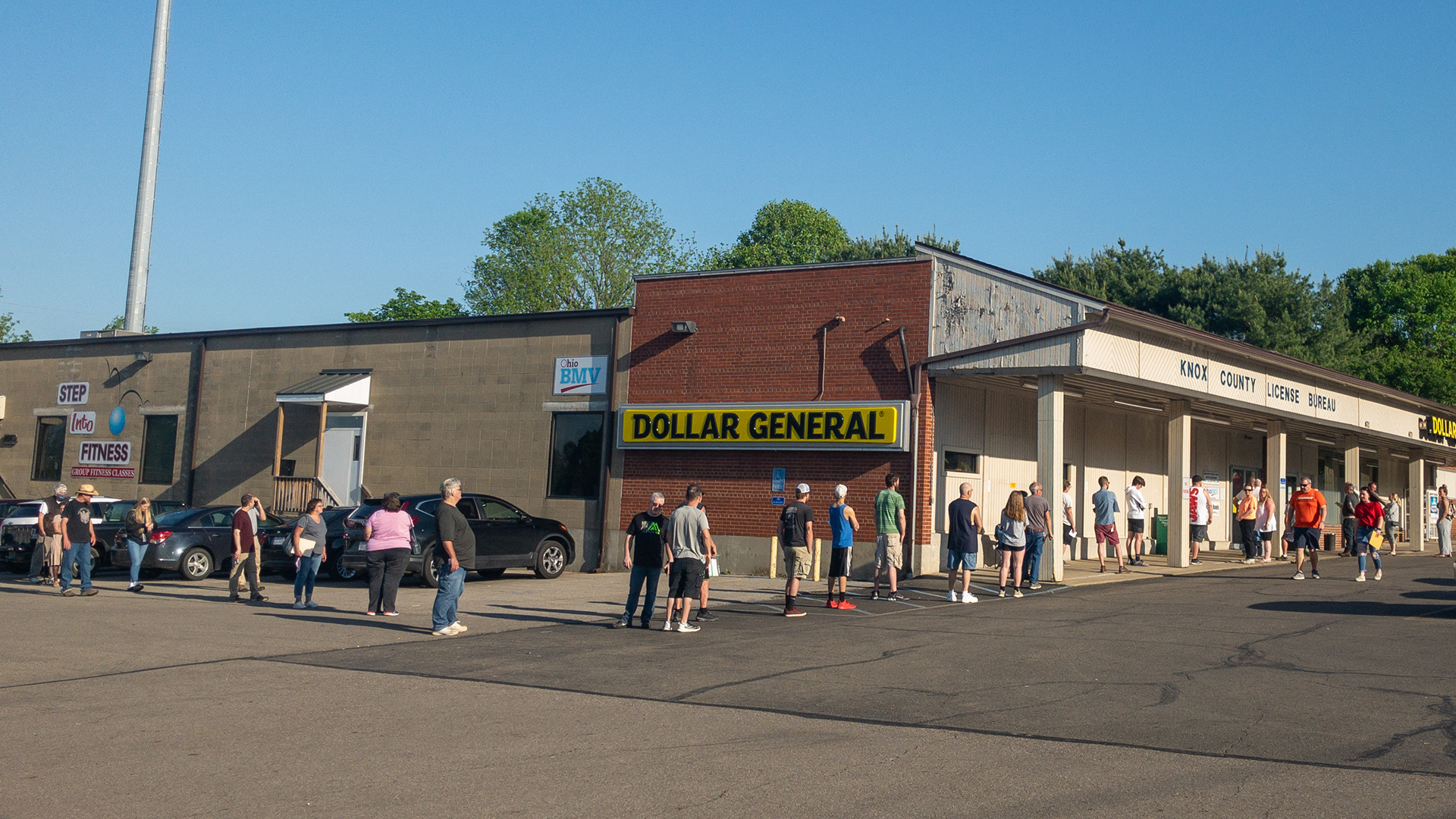 The line of people at the Ohio Bureau of Motor Vehicles, 671 N Sandusky Street, stretched out along the outside of the building on May 26, 2020. Over three dozen people were waiting outside as license services restarted after being closed since March. The BMV reminds people that some services can be done at oplates.com. Licenses that expired after March 9 are still valid until 90 days after the state of emergency ends or December 1, 2020, whichever comes first.