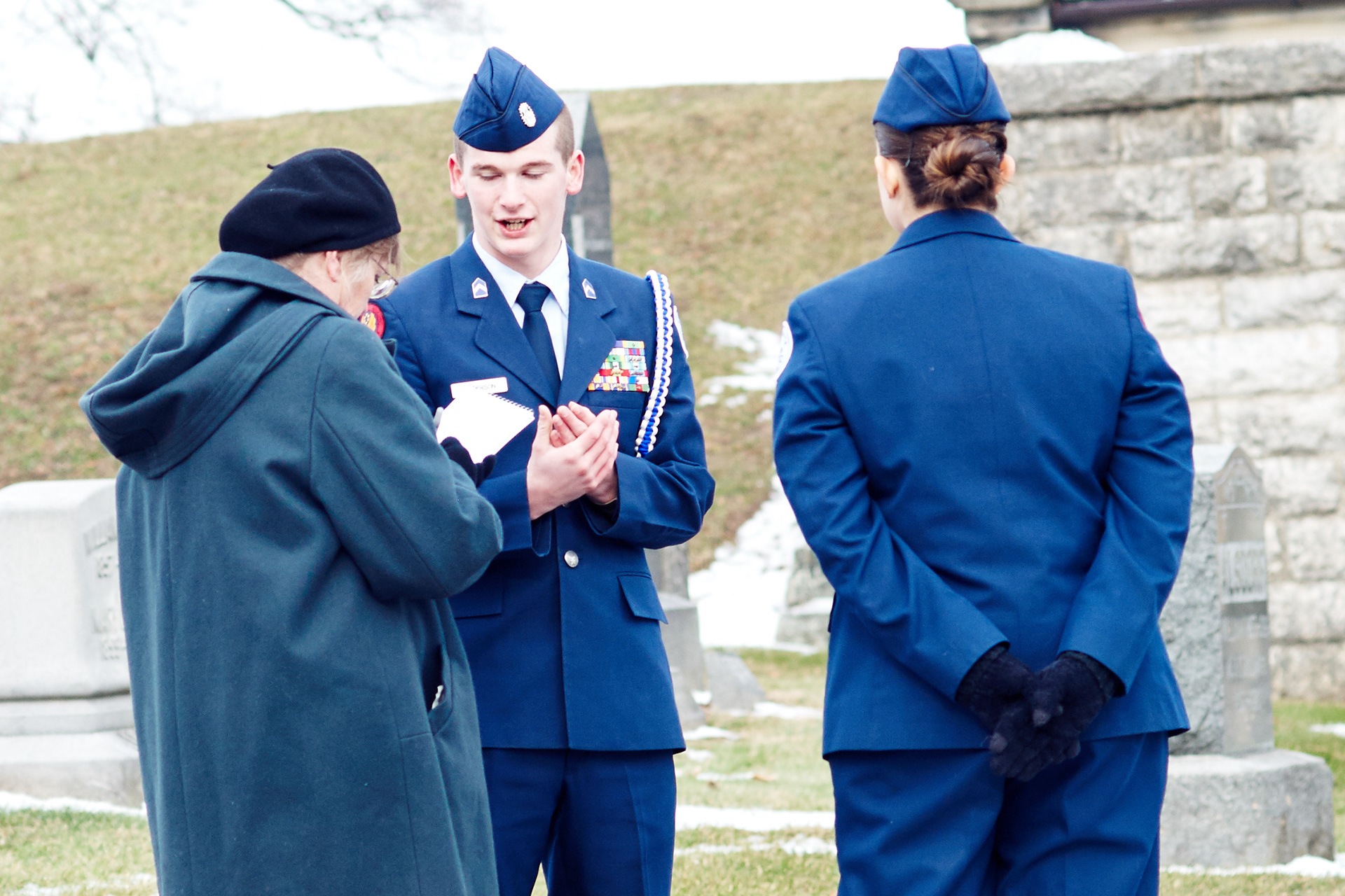 Reporter Pam Schehl interviews two members of the Knox County Career Center JROTC for Wreaths Across America.