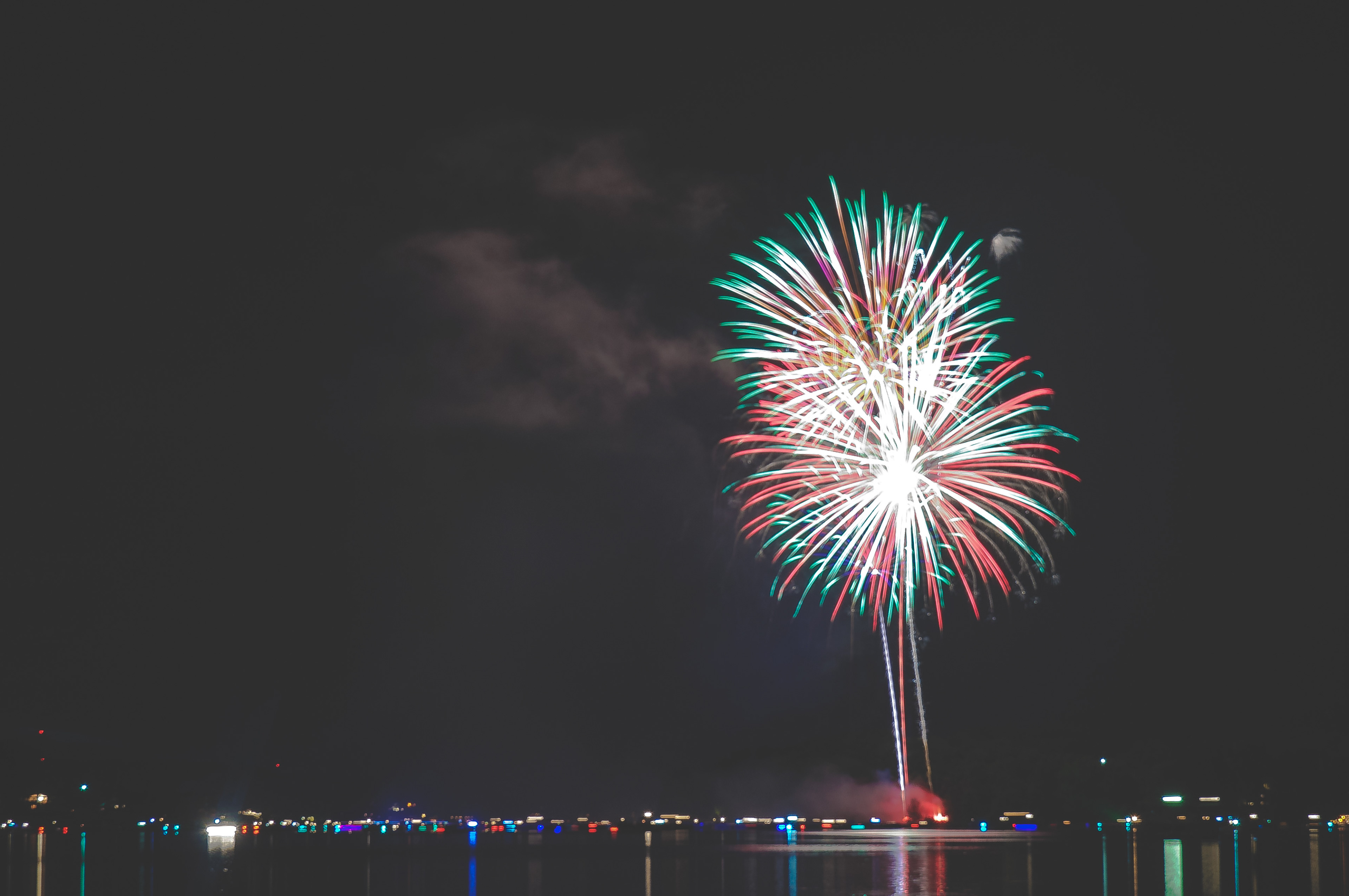 Shells explode over the boats on Apple Valley Lake