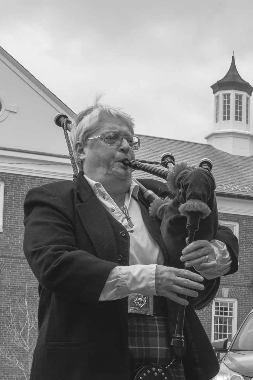 Ginny Cameron performs on the bagpipes in the Mount Vernon Public Square on April 10, 2020. Drivers stopped and pulled into parking spots and people sat on the benches to listen. 