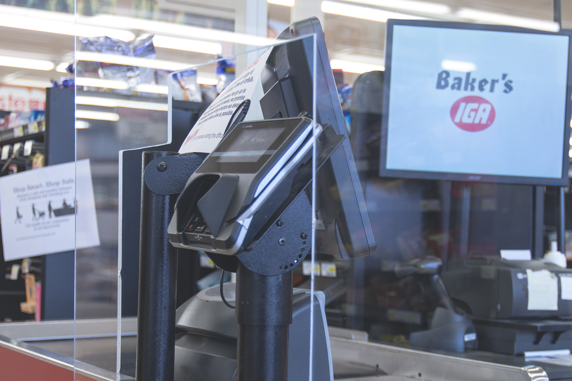 New Plexiglas partitions were installed at the checkout lanes of Baker’s IGA, 524 South Main Street. The protective barriers along with floor decals are showing up at grocery stores and gas stations to promote physical distancing.