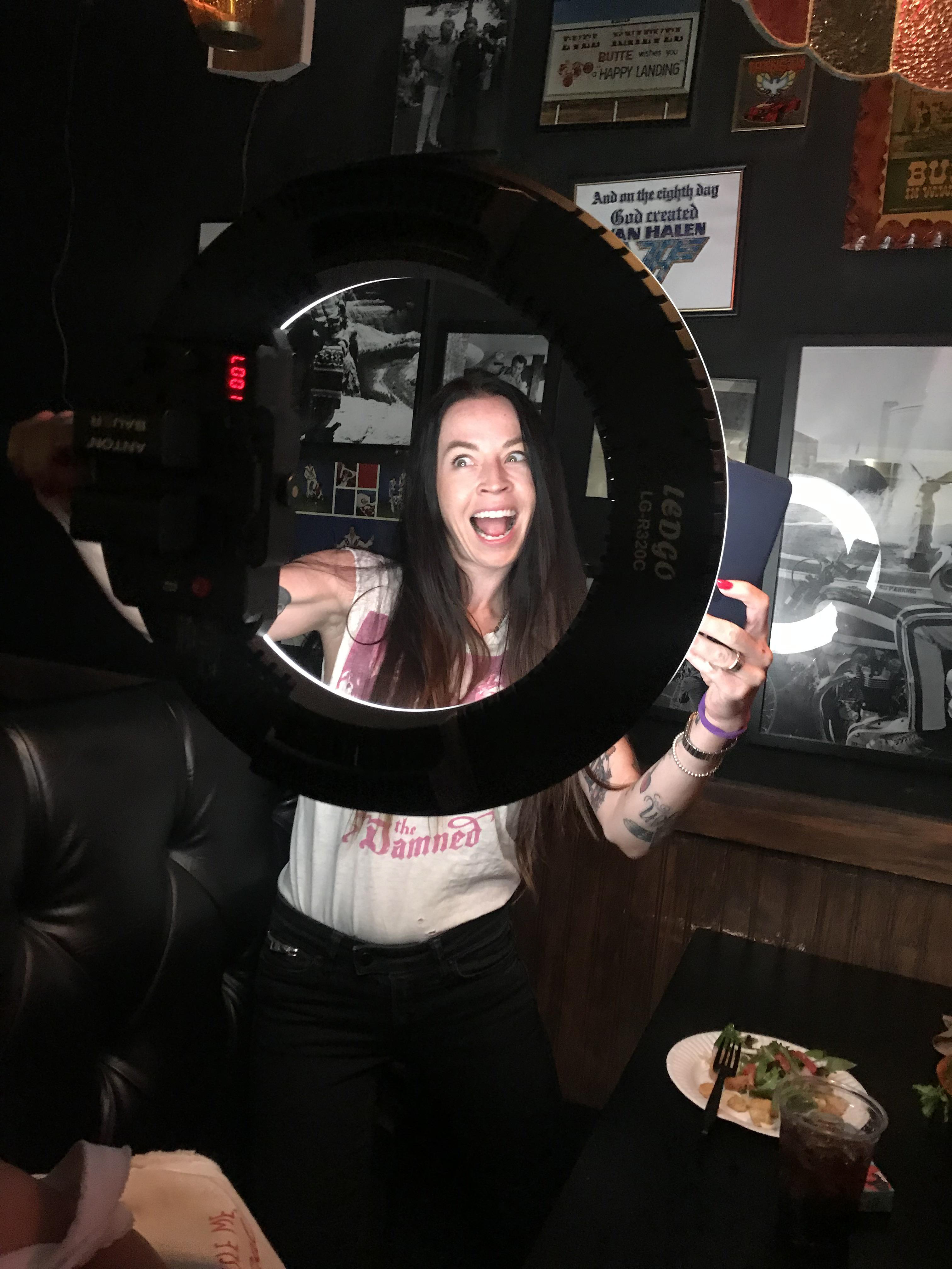 Roxie Amoroso poses with a ring light during a photo shoot on fremont street in Las Vegas, Nevada.