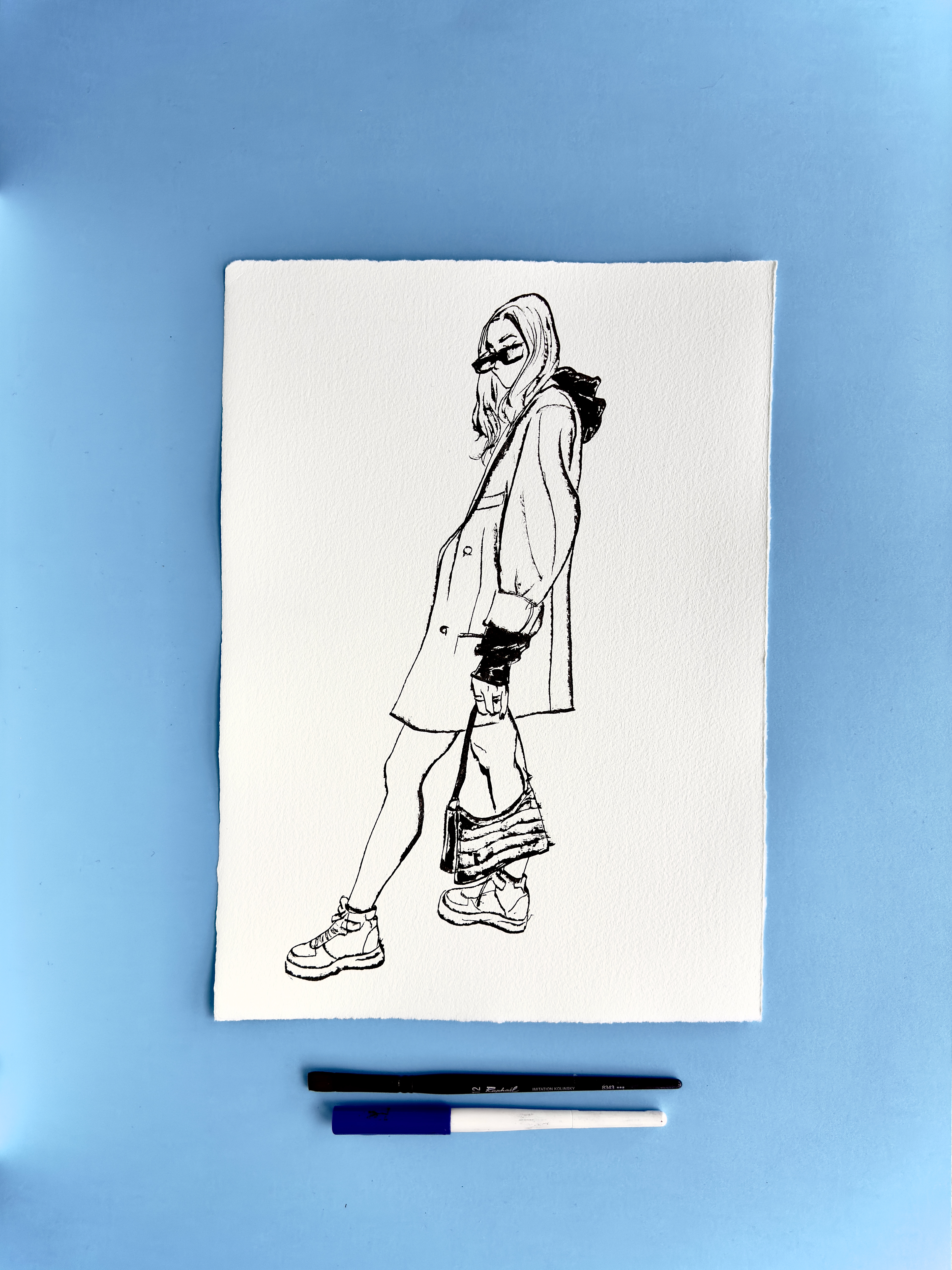 I DRAW YOU is an ongoing series of contemporary figure drawings exploring everyday bodies, fashion, and movement through expressive ink linework on textured cotton paper. Each piece captures real people in natural, unposed moments—walking, skating, taking selfies, or simply inhabiting their clothes—transforming daily gestures into minimal, dynamic portraiture.  Drawn with a combination of brush, parallel pen, and ink, the series focuses on gesture, proportion, and character, emphasising rhythm and immediacy over facial detail. Instead of traditional portrait likeness, the drawings celebrate silhouette, attitude, and personal style, making each figure both intimate and universal.  These original artworks sit at the crossroads of illustration, fashion drawing, and figurative art, making them ideal for collectors interested in line art, contemporary drawing, and minimal ink portraits. Every piece is hand-drawn on archival 250–300g paper, preserving the texture and spontaneity of the process.  Perfect for art lovers looking for unique figure drawings, modern ink artwork, or original works on paper that highlight the beauty of everyday bodies and the immediacy of the drawn line.