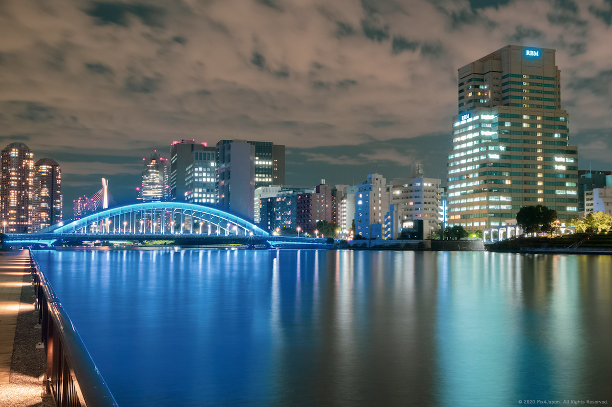 Wide-Angle Shot of Urban River Shoreline
