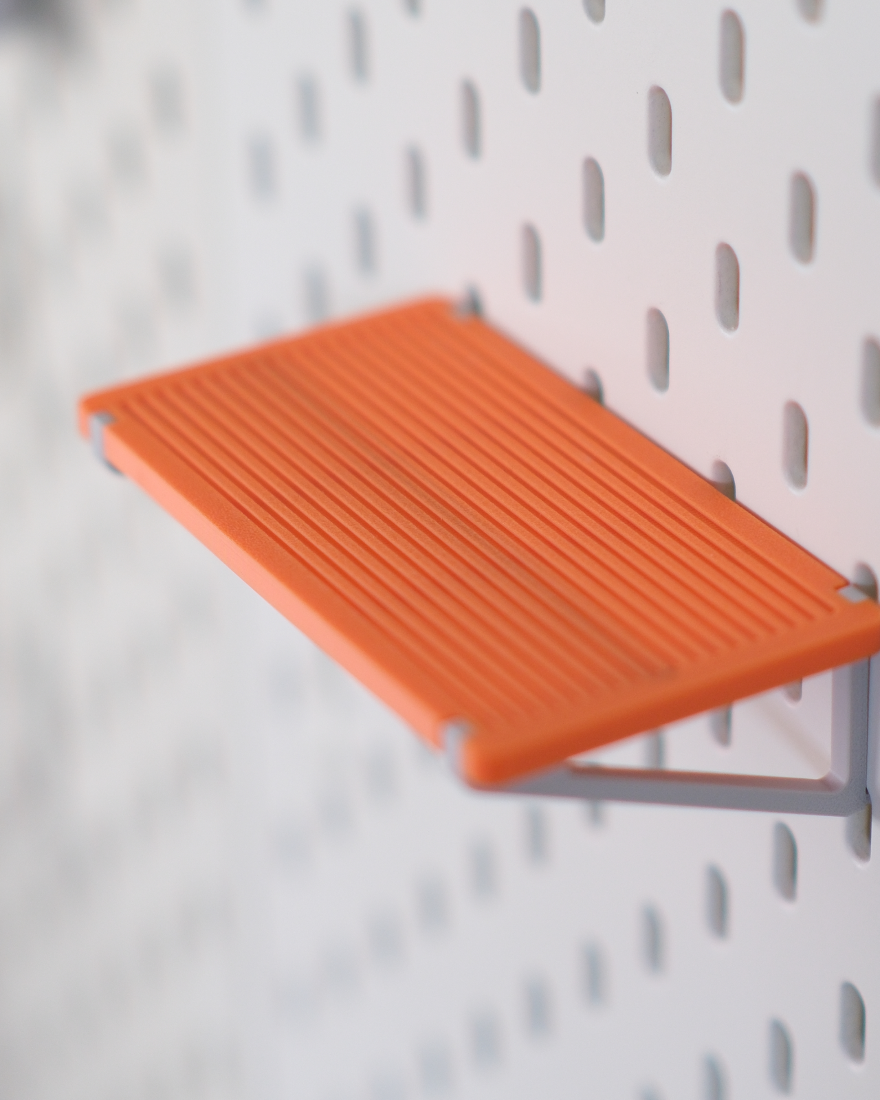 05 ikea_skadis_minimal_toy_display_shelf_snap_on_pegboard_shelf_for_mini_figures