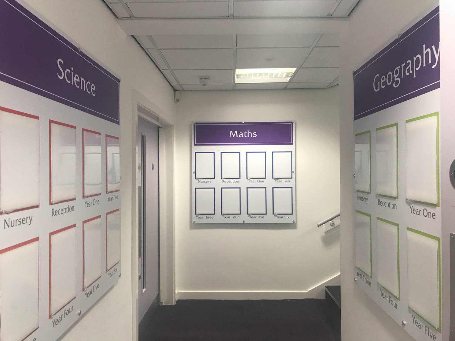 Foamex displays with document holders. St. Francis Primary, Morley had the innovative idea of having boards displaying work for each subject and class in a corridor area. Religious Education board was in the Hall.