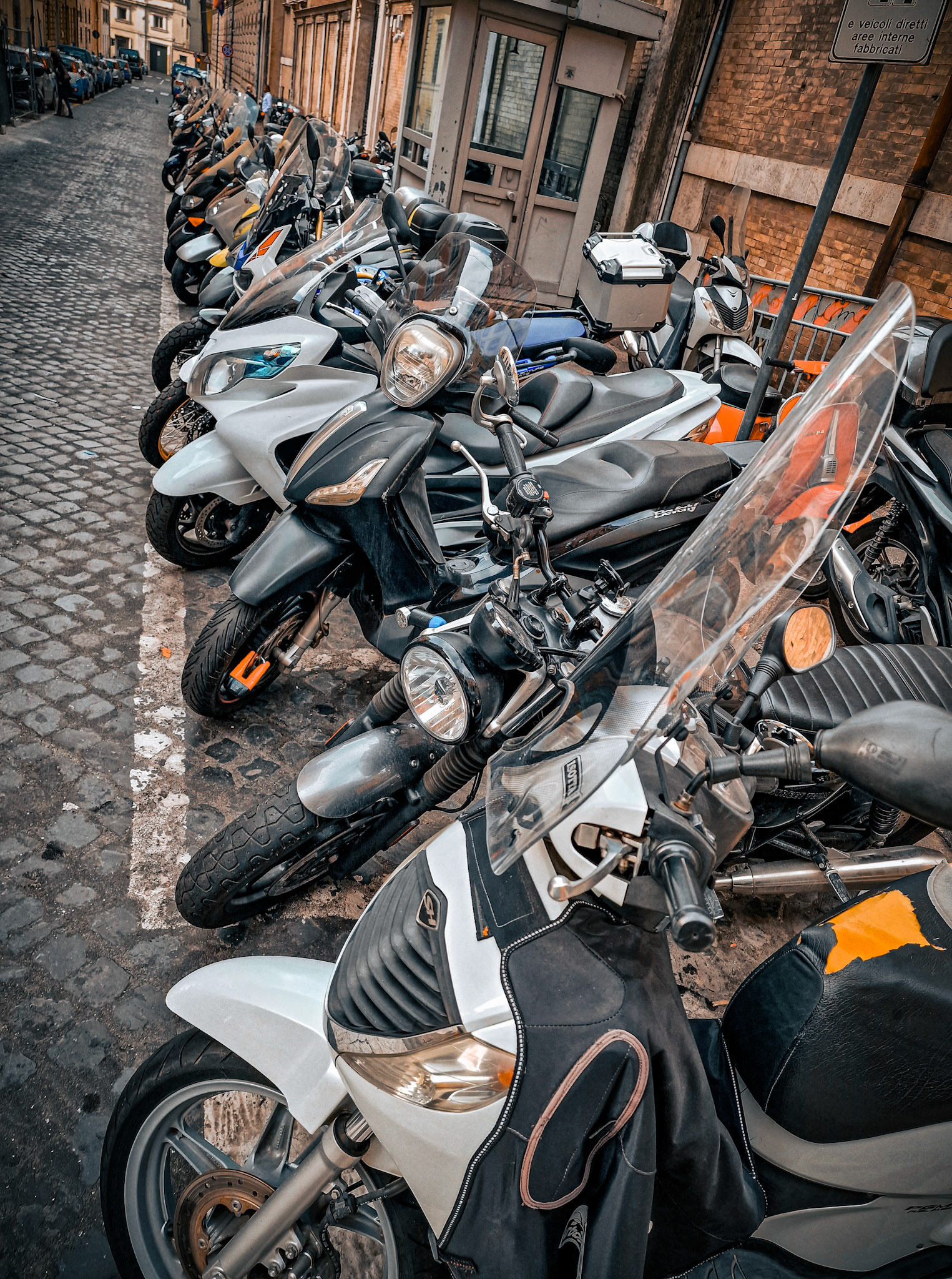 Motorcycles in a narrow street, Rome, Italy