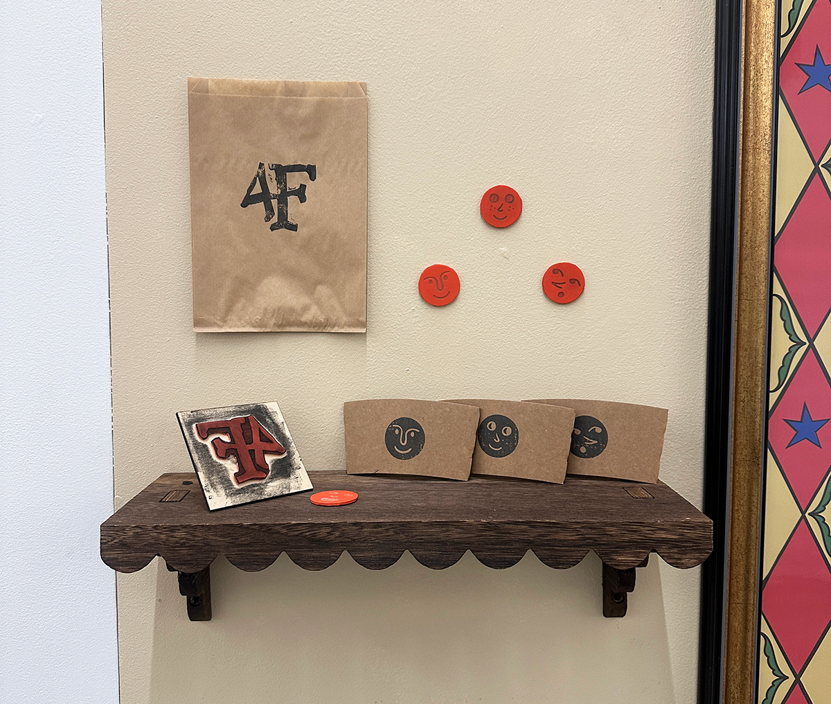Right shelf with rubber stamps made at the campus makerspace.
