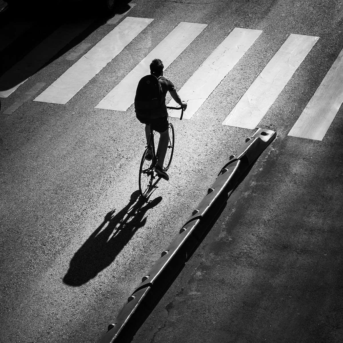 Madrid - Cyclist and Shadow Riding Into the Light (1:1)