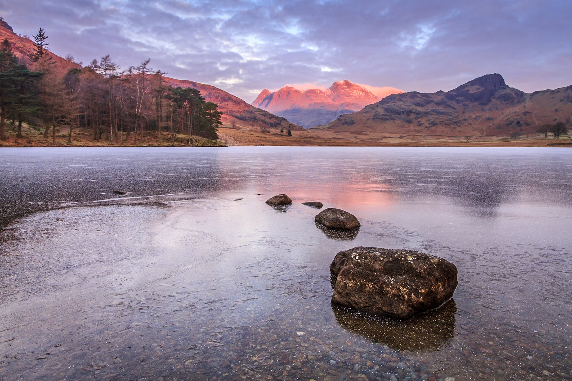 Blea Tarn I: Sunrise over a frozen Bea Tarn, with the Langdale Pikes in the Background