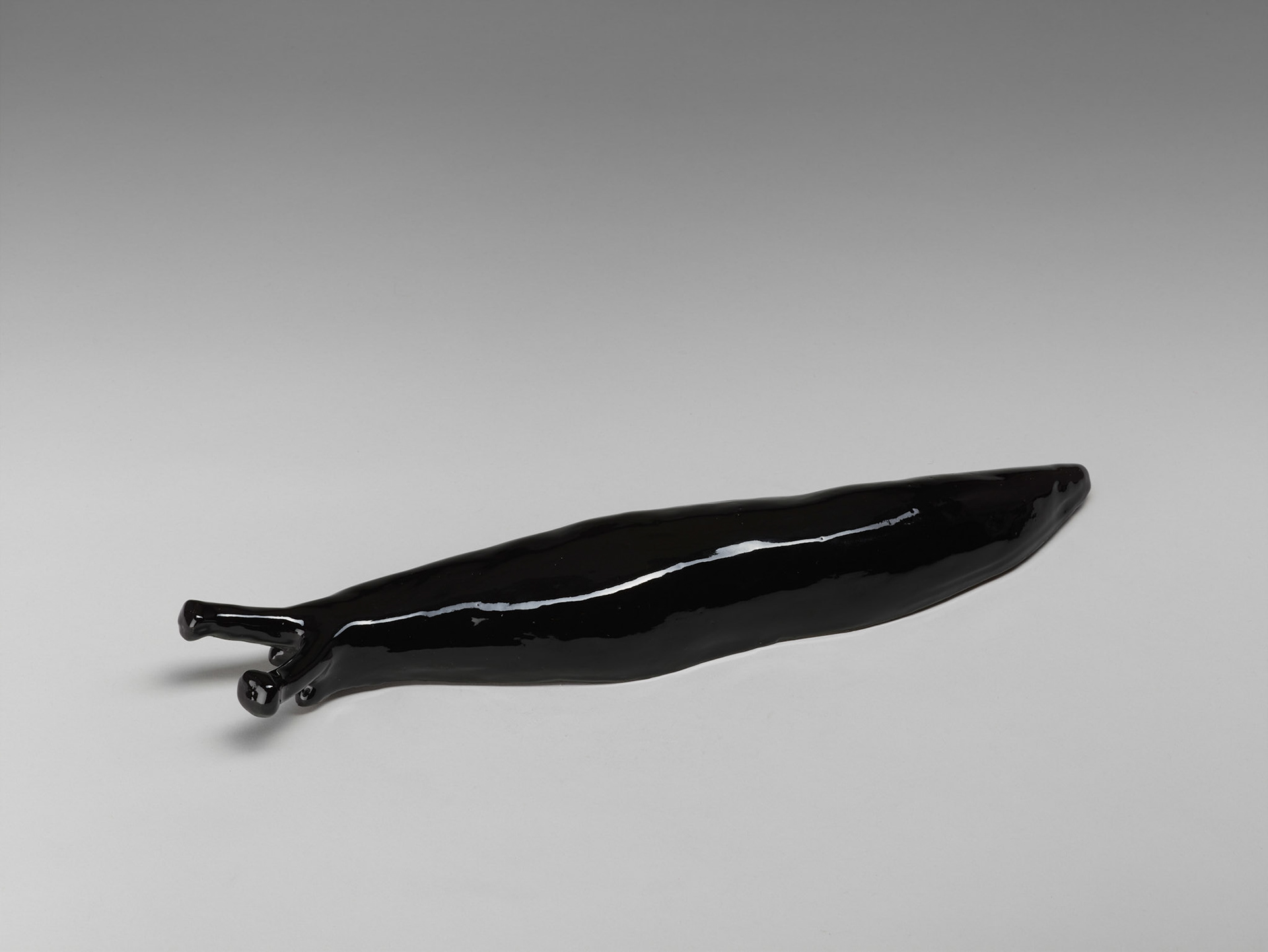 Kiki Kogelnik ! Untitled (Snail) 1987 — Glazed ceramic — 3 1/4 x 18 1/8 x 3 1/4 inches (8 x 46 x 8 cm)