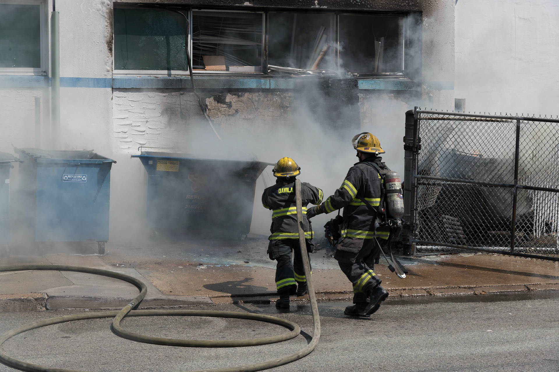 Philadelphia Box 391, N. 8th Street and Callowhill Street. Multiple dumpsters extended to an occupied 5 story commercial building.
