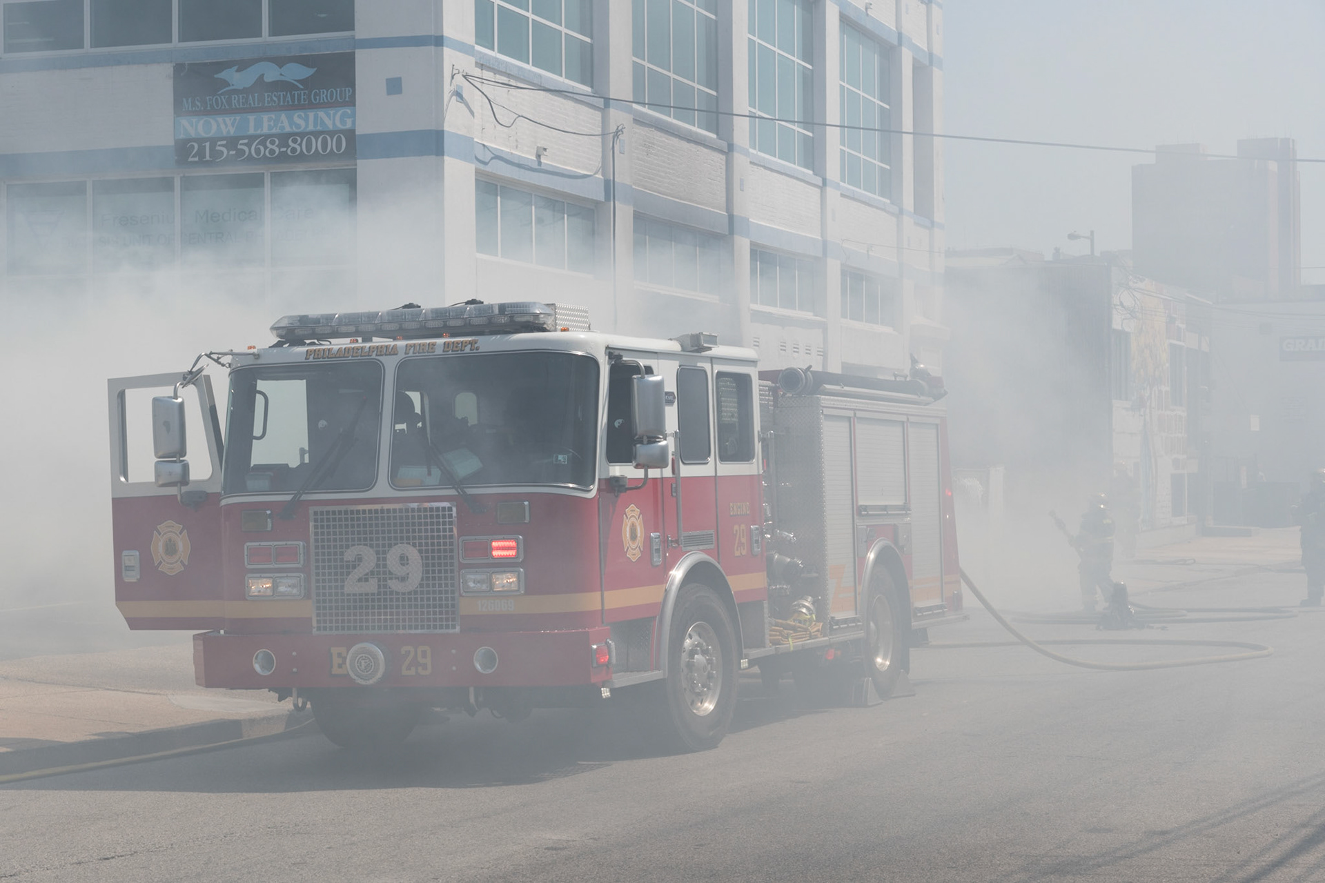 Philadelphia Box 391, N. 8th Street and Callowhill Street. Multiple dumpsters extended to an occupied 5 story commercial building.