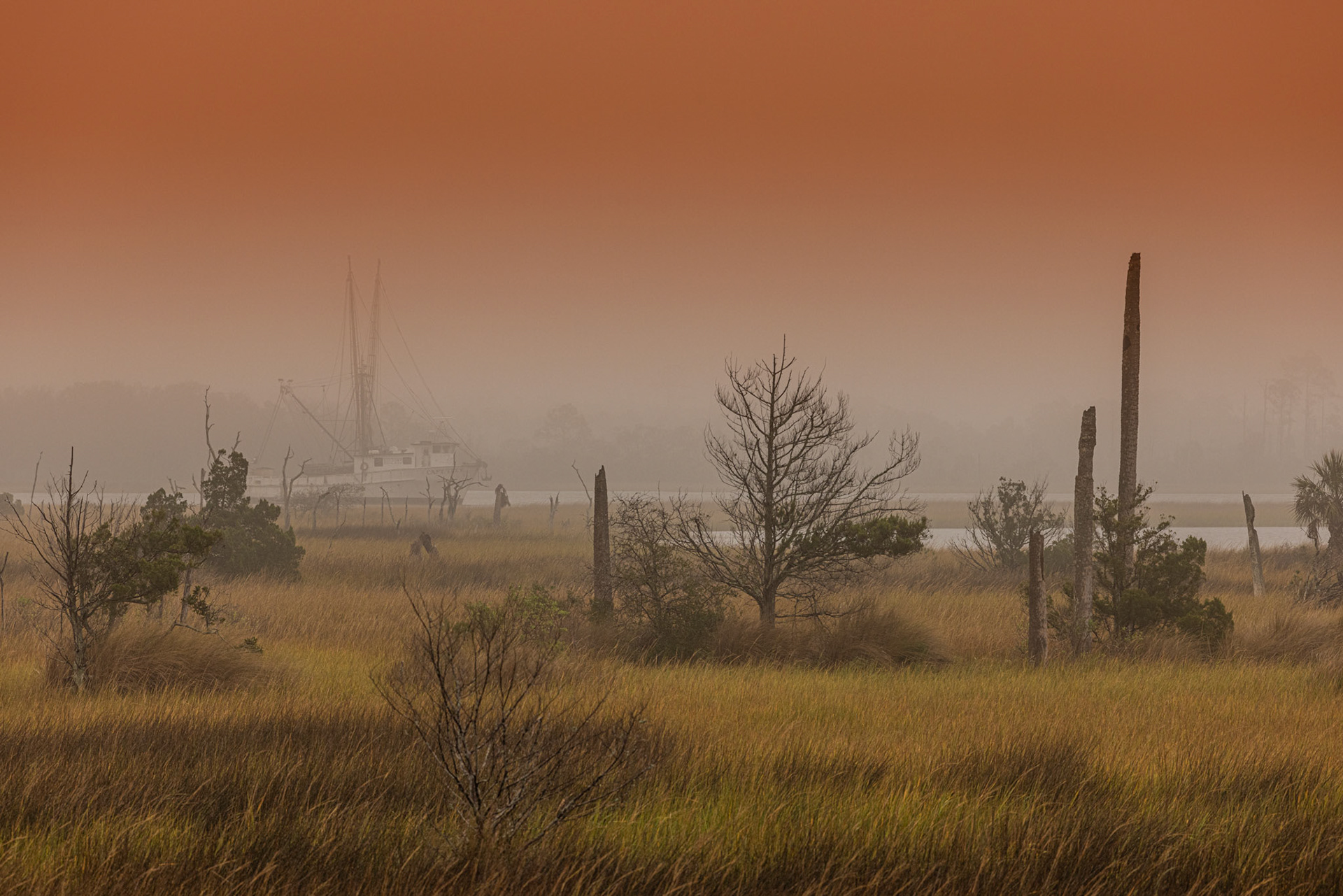 Shrimp boat at dawn on a foggy day on the ICWW
