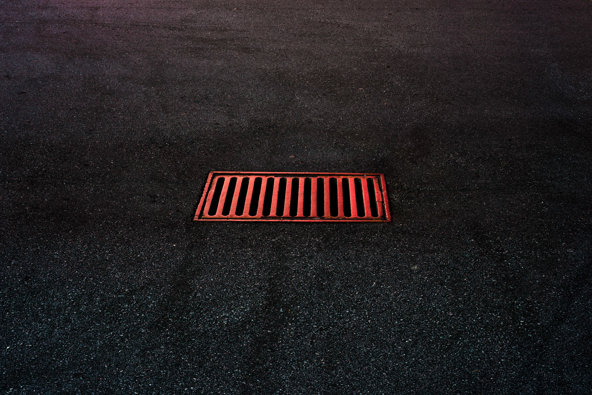 Sewer grate under artificial light, Atlanta Georgia 2014