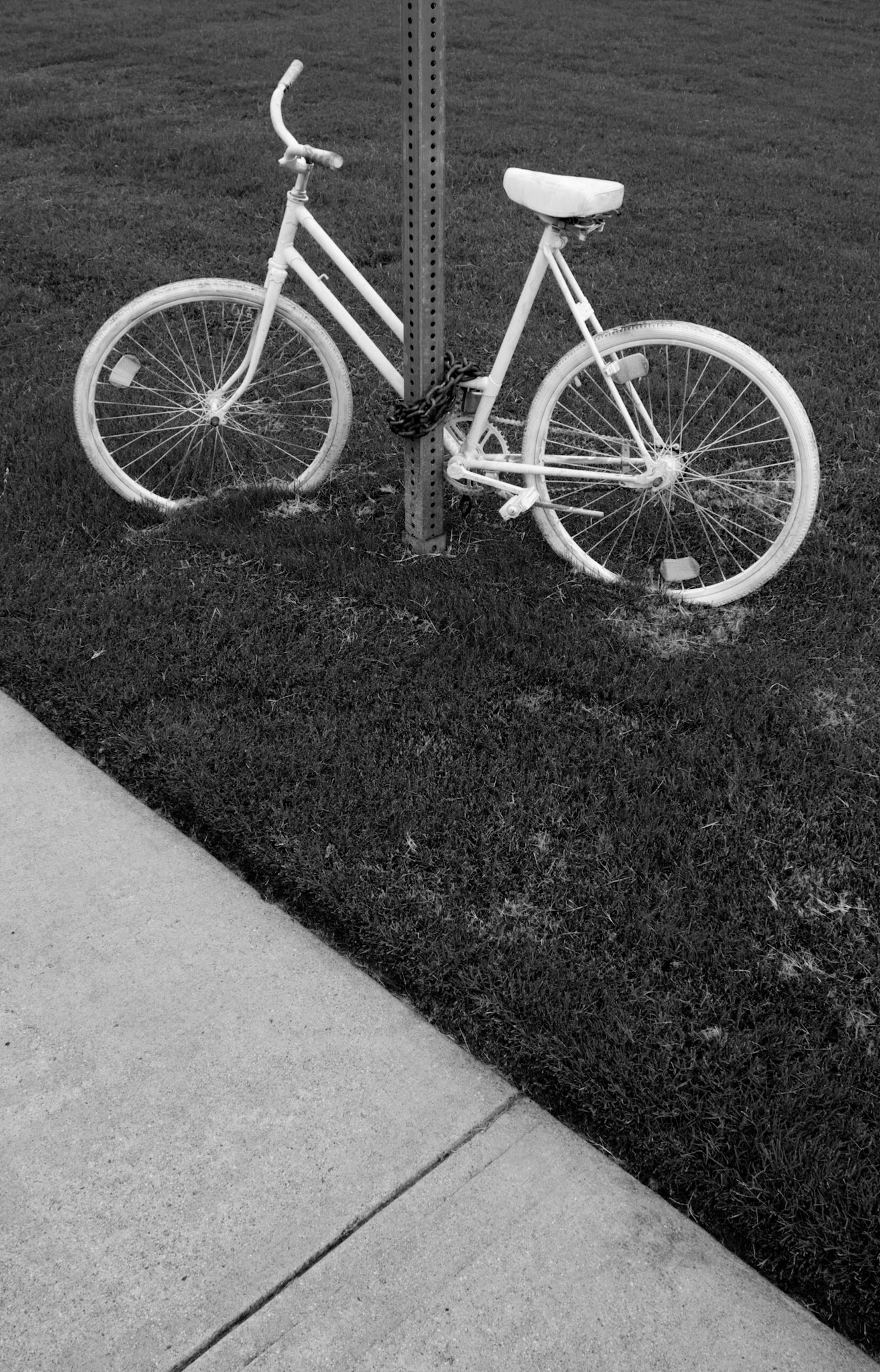 White Bicycle Chained to a Street Sign (ghost bike), Atlanta Georgia 2011
