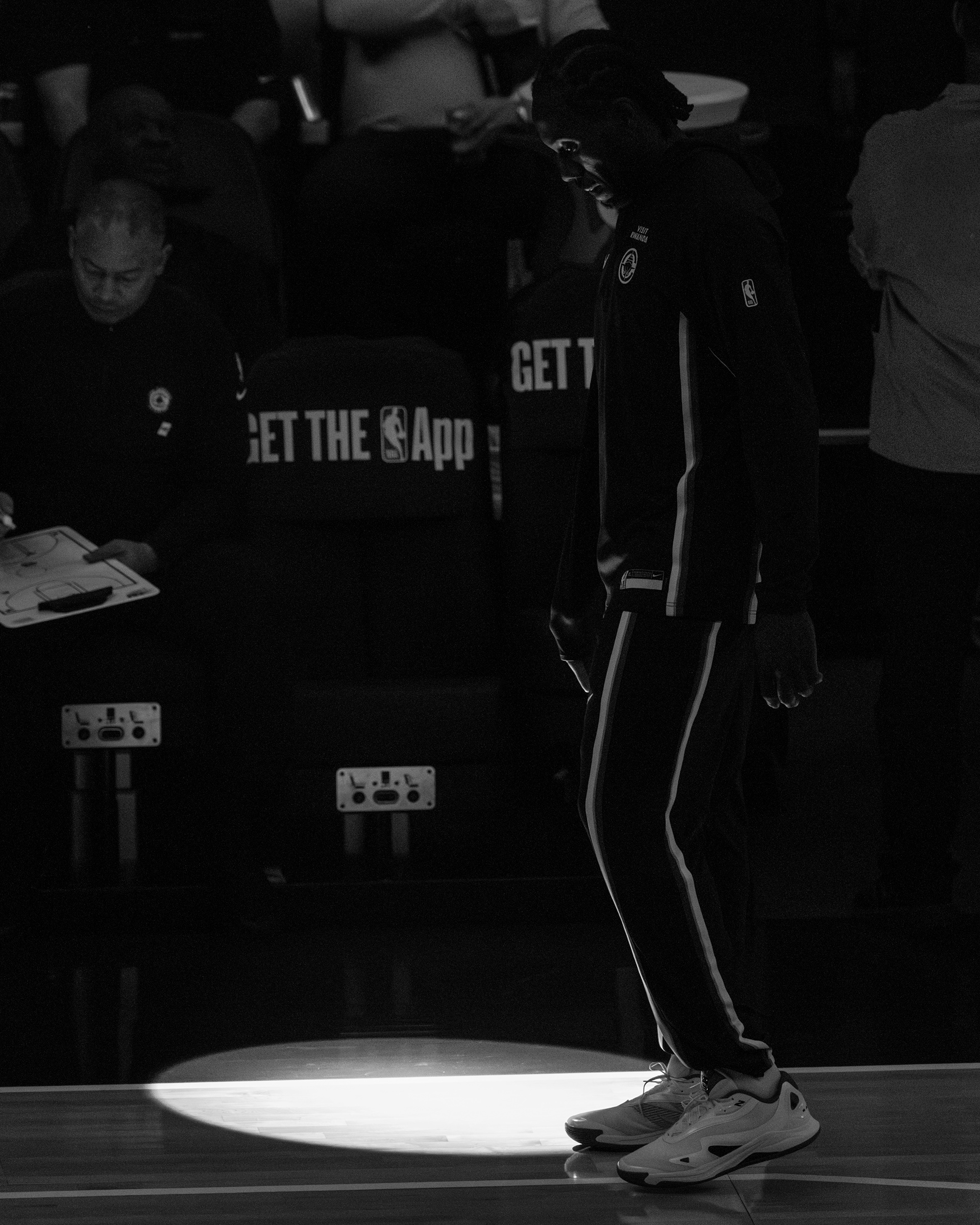 LA Clippers forward Kawhi Leonard stands on the court before a game at Intuit Dome in Inglewood, CA