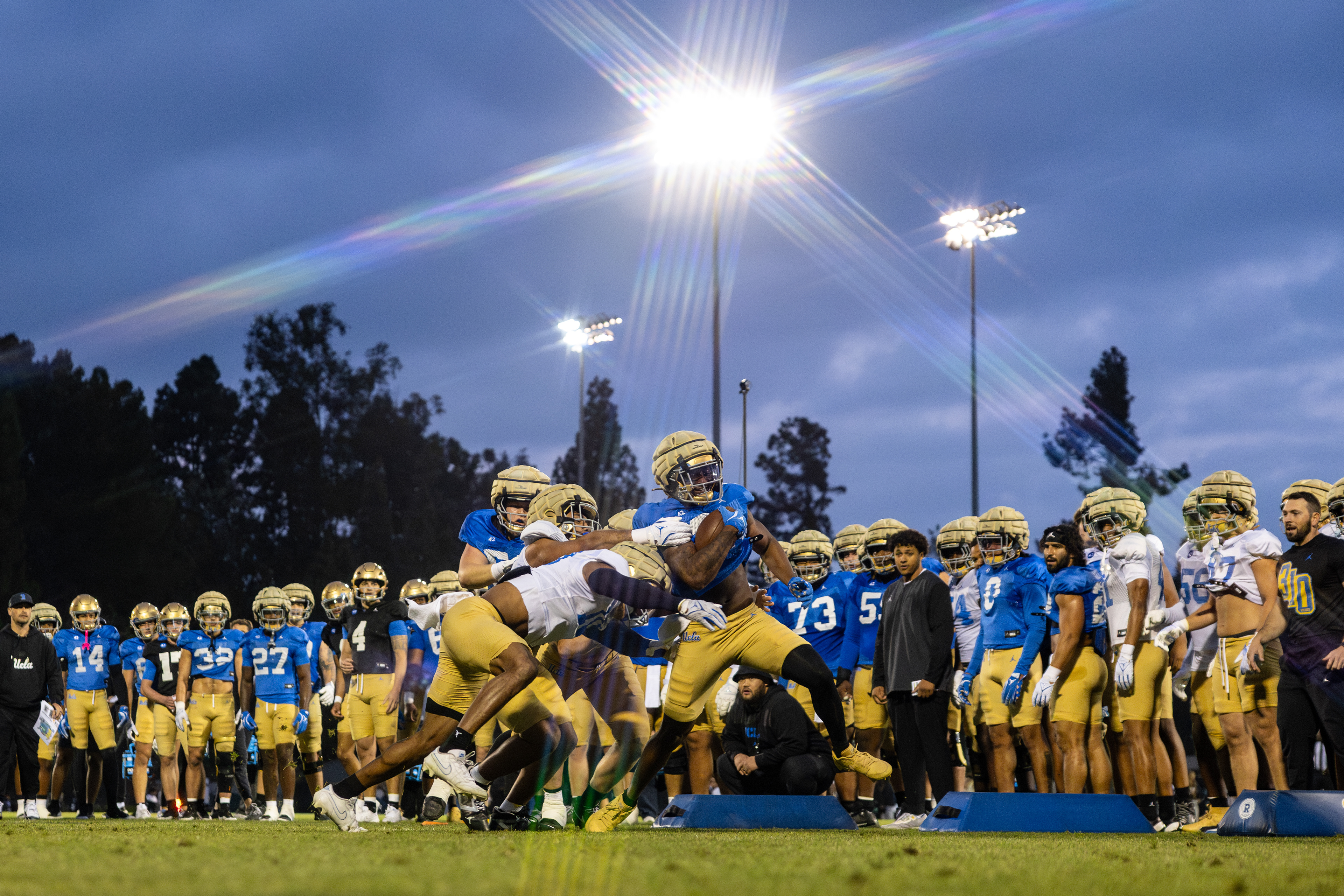UCLA football players compete in practice prior to the NCAA college football season at Drake Stadium in Los Angeles, CA