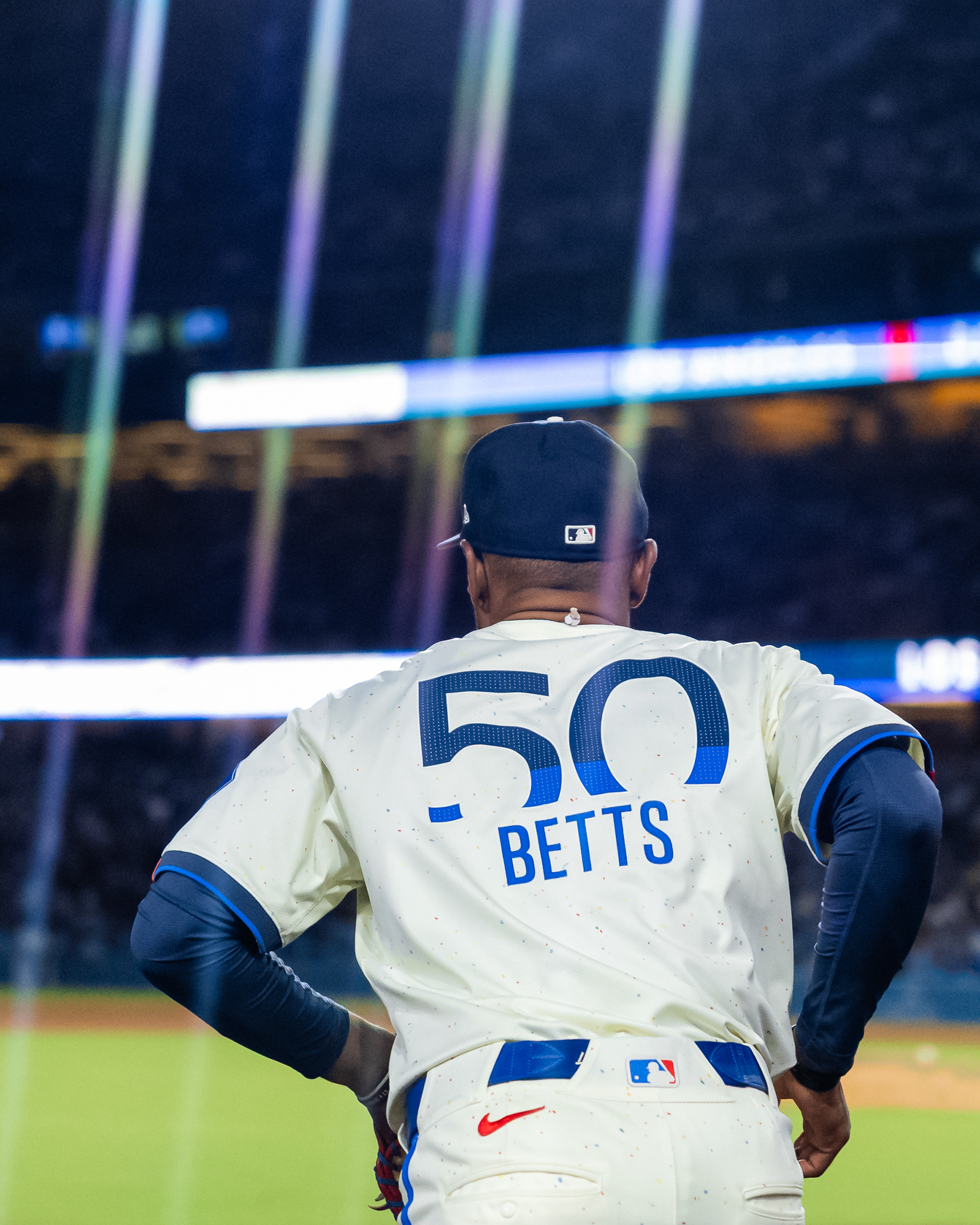 Los Angeles Dodgers shortstop Mookie Betts runs out of the dugout during a Major League Baseball game at Dodger Stadium in Los Angeles, CA