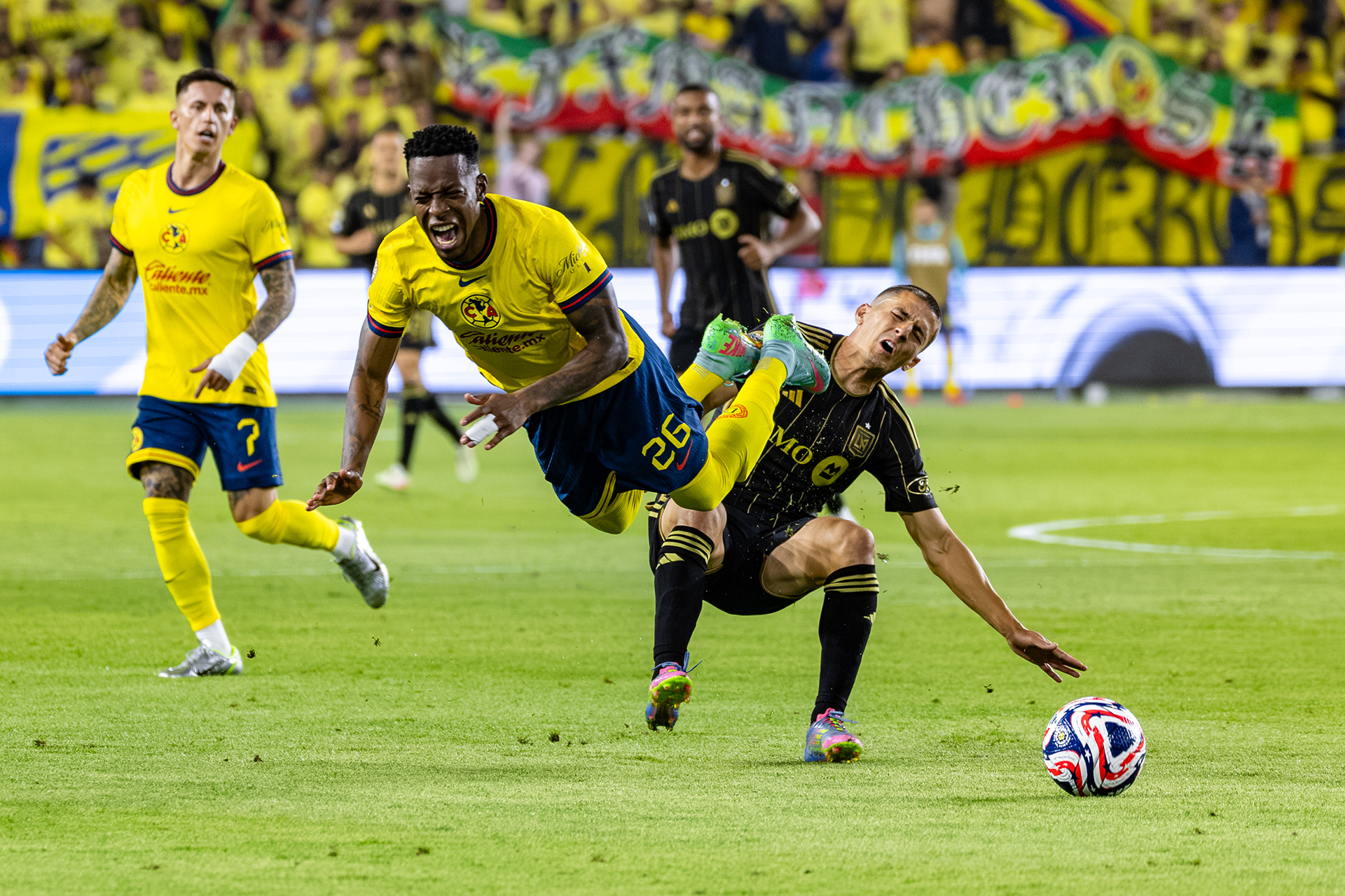 Club América midfielder Cristian Borja and LAFC defender Sergi Palencia collide during a FIFA Club World Cup play-in match, Saturday May 31, 2025 in Los Angeles, Calif.