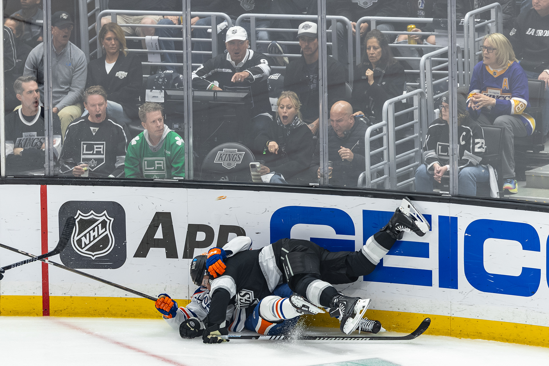 Los Angeles Kings and Edmonton Oilers players fight for the puck during during a NHL hockey Stanley Cup Playoff Game at Crypto.com Arena in Los Angeles, CA
