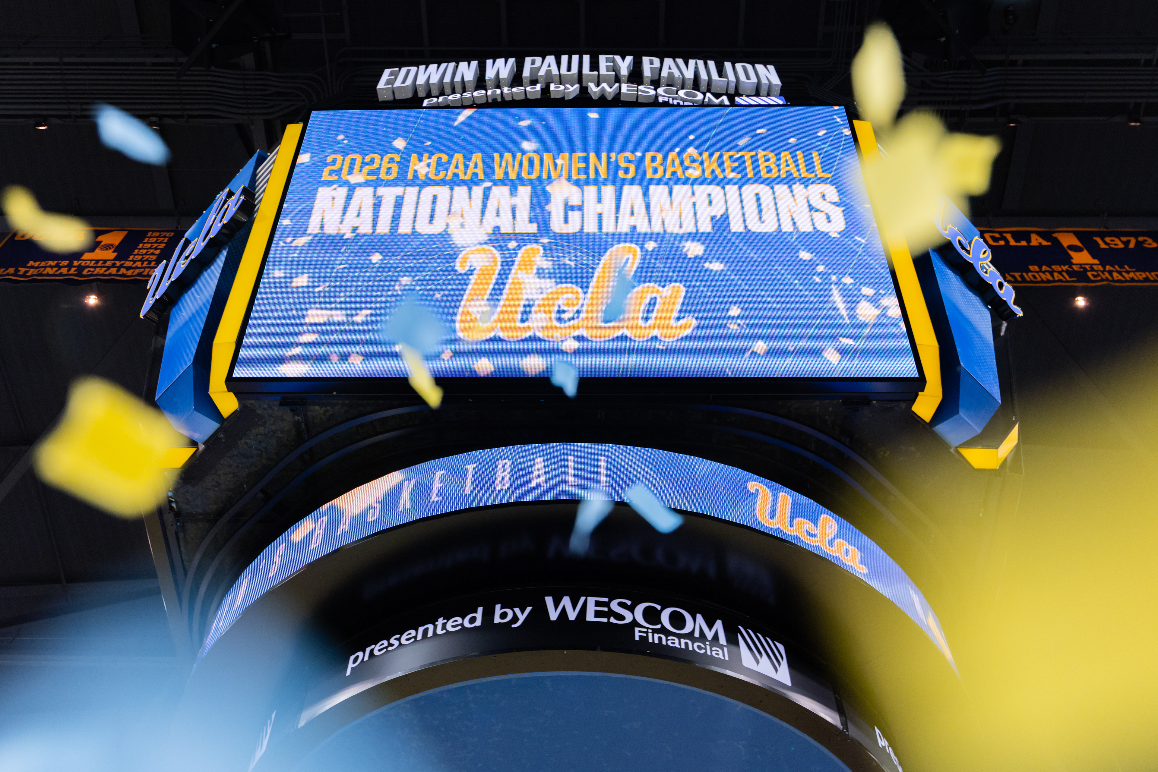 The scoreboard at Pauley Pavilion celebrates the NCAA champion UCLA women's basketball team as confetti falls in Los Angeles, CA