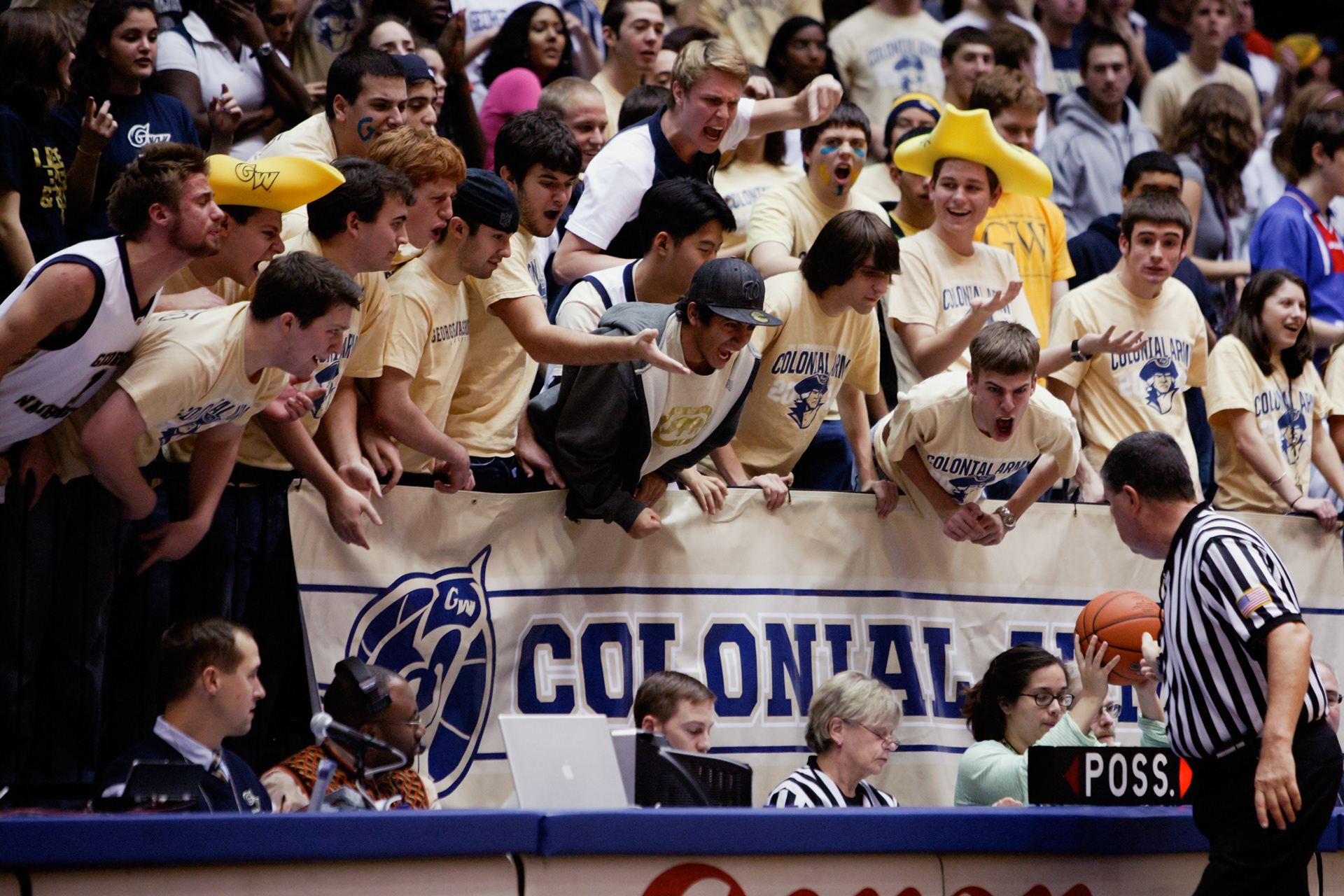 College basketball fans at George Washington University question a call by a referee at the Charles E. Smith Center in Washington, DC