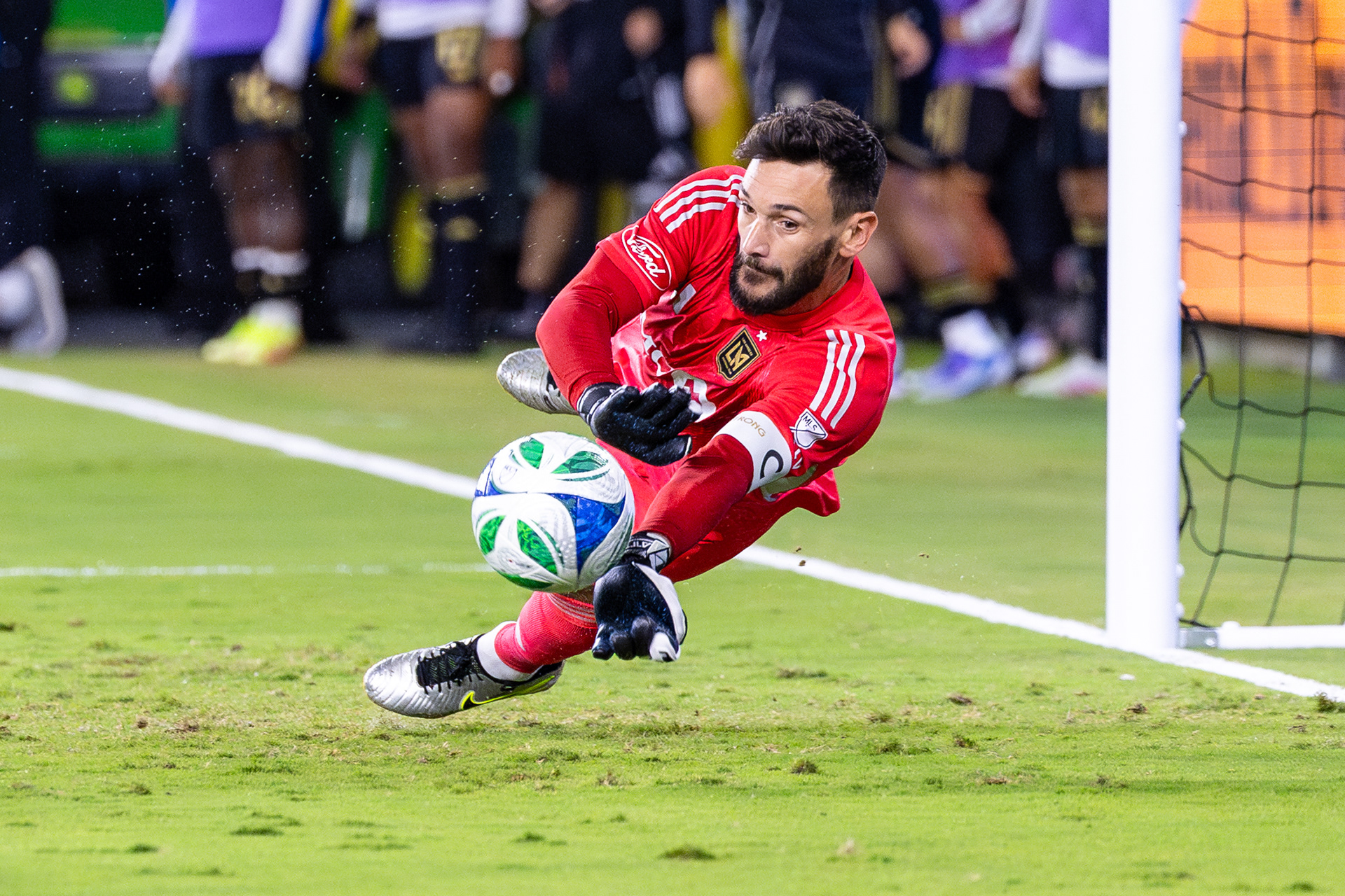 LAFC goalie Hugo Lloris makes a diving save in an MLS match.