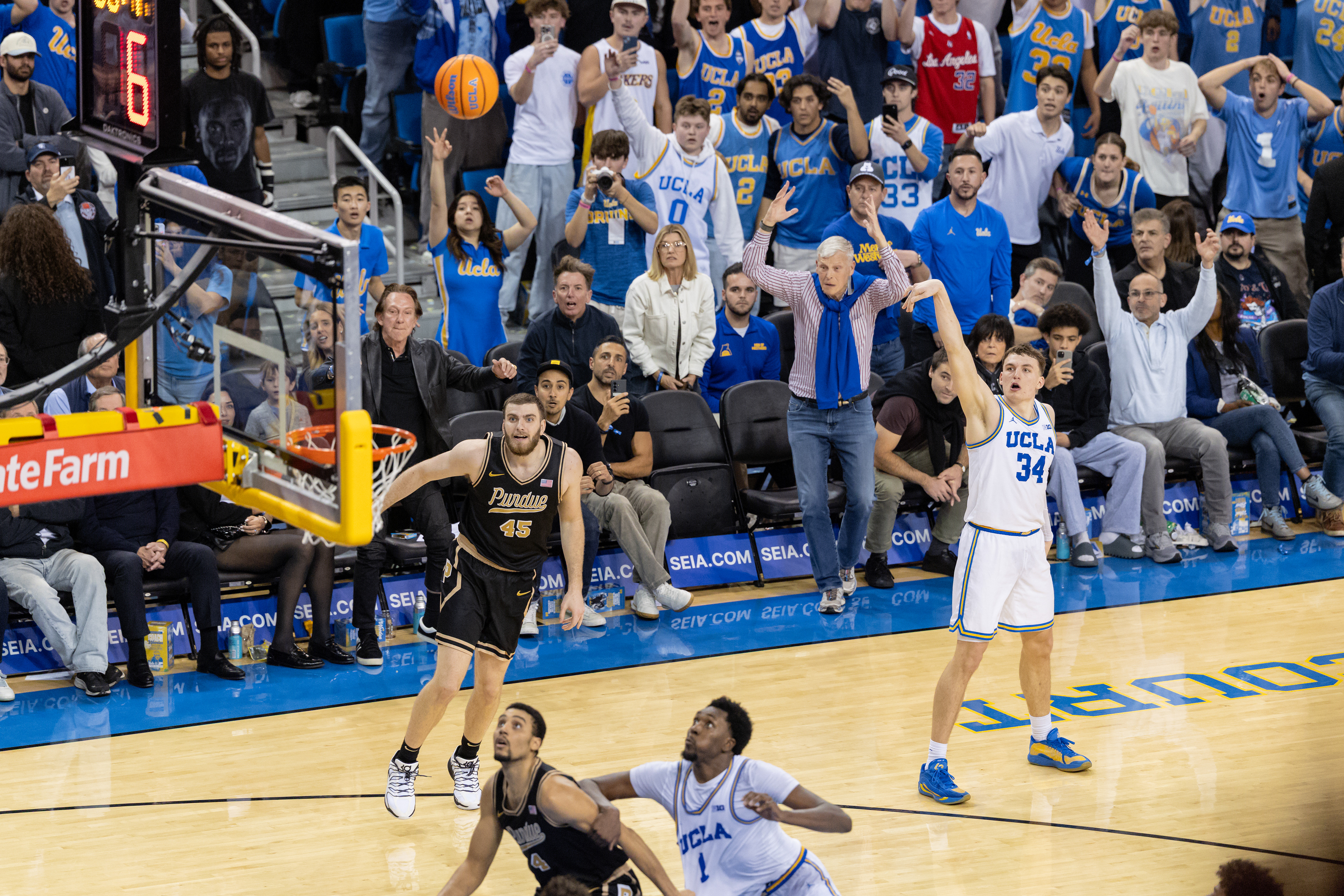 UCLA forward Tyler Bilodeau makes the game-winning three point shot during an NCAA basketball game at Pauley Pavilion in Los Angeles, CA