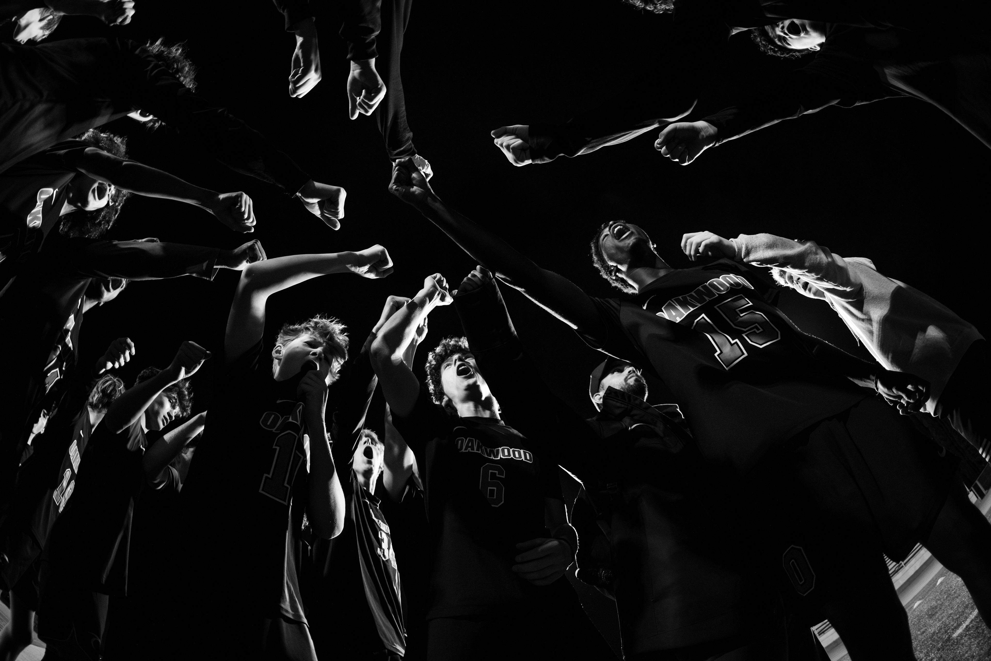 Oakwood soccer players huddle before a high school soccer game.