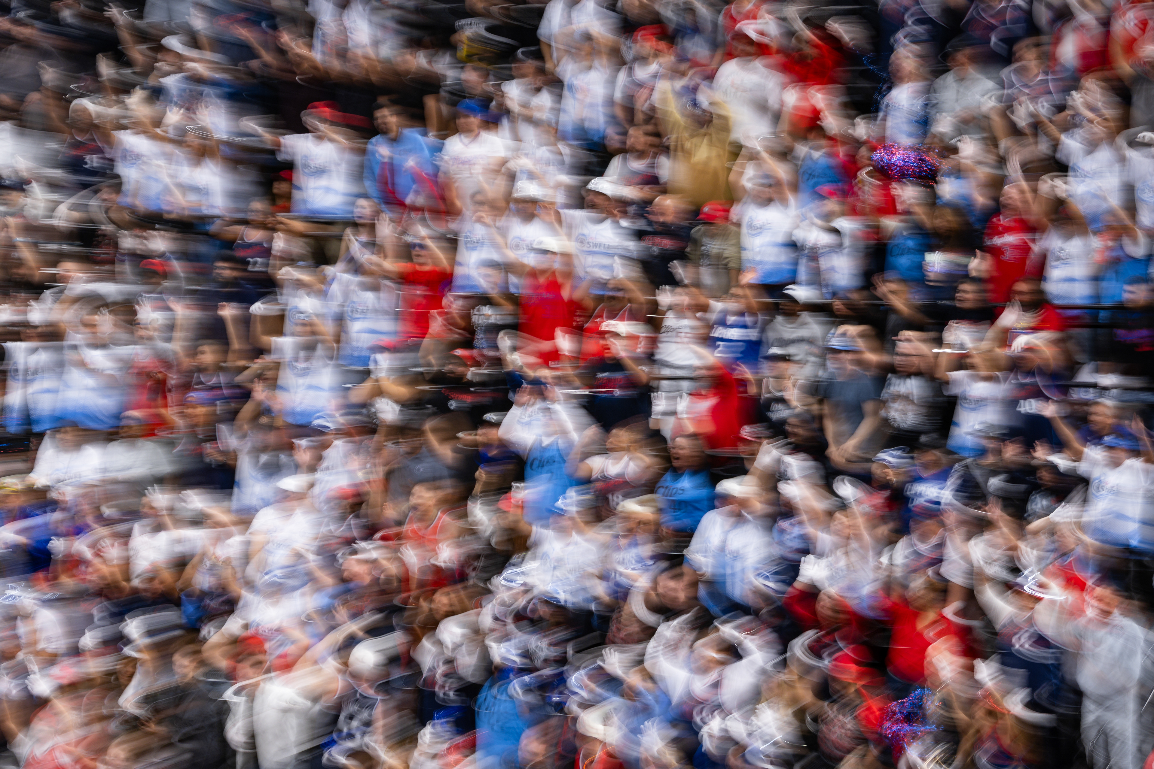 LA Clippers fans cheer during an NBA basketball game at Intuit Dome in Los Angeles, CA