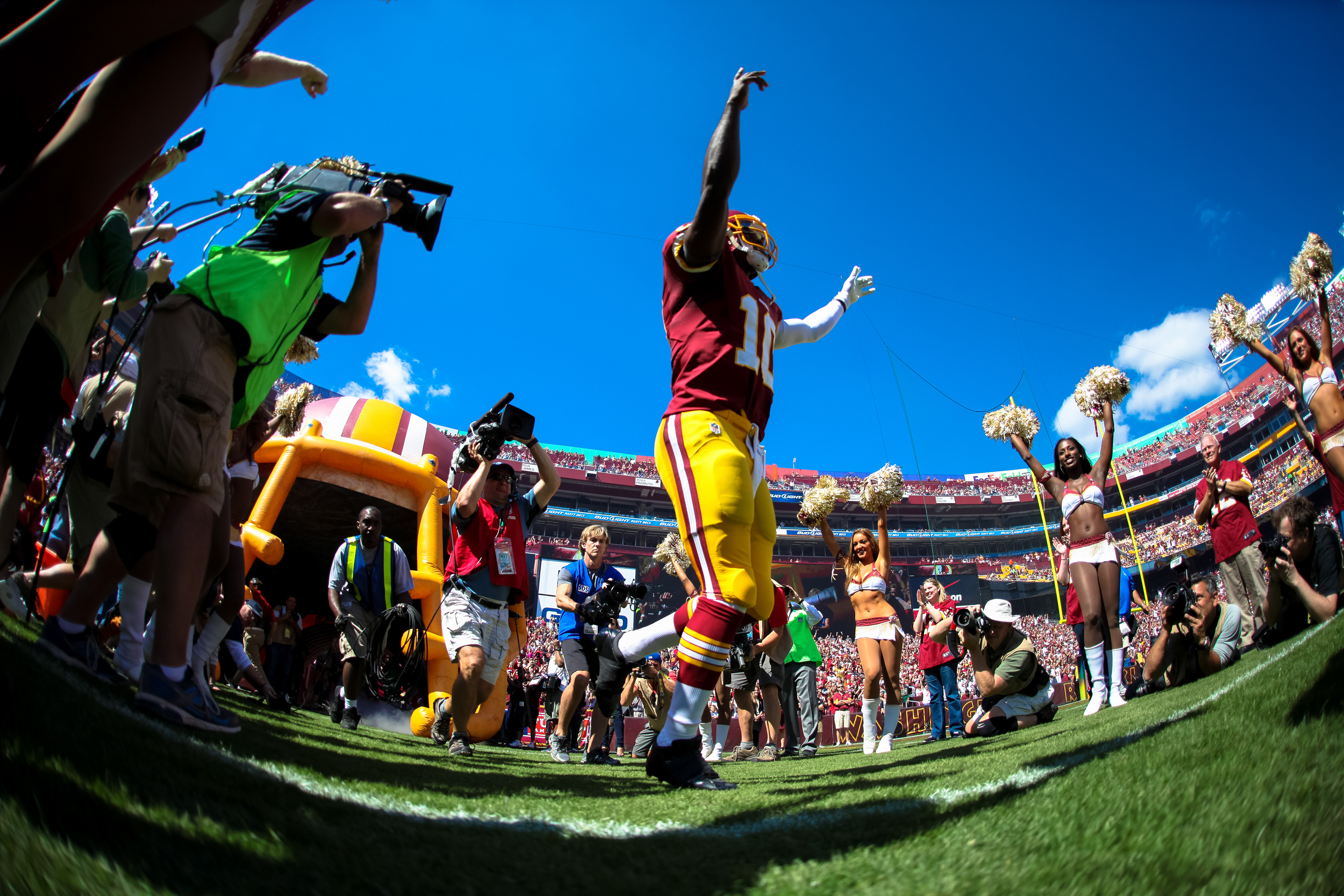 Washington quarterback Robert Griffin III runs out of the tunnel at FedEx Field in Landover, MD