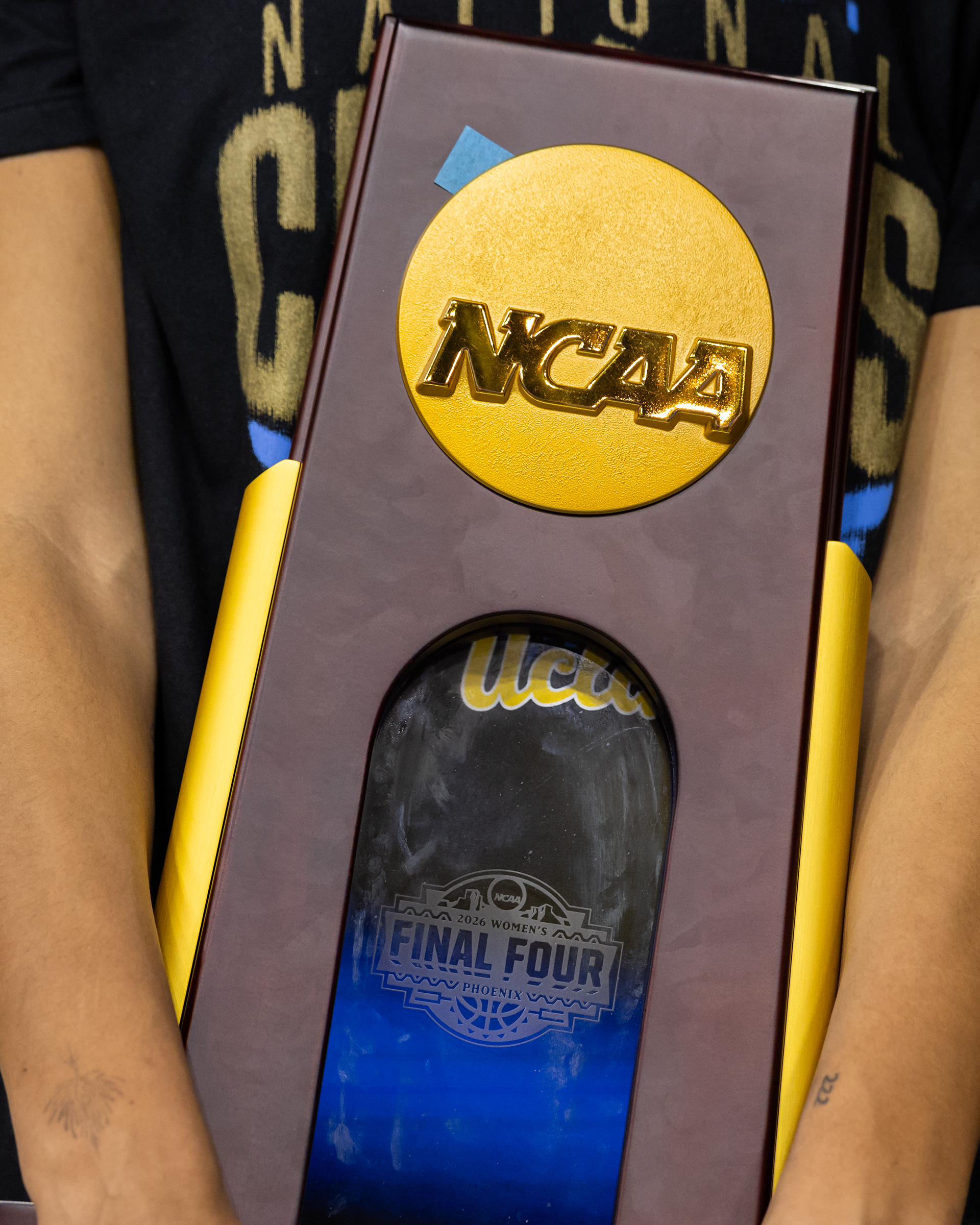 UCLA center Lauren Betts holds the NCAA Women's Basketball National Championship trophy during a celebration at Pauley Pavilion in Los Angeles, CA