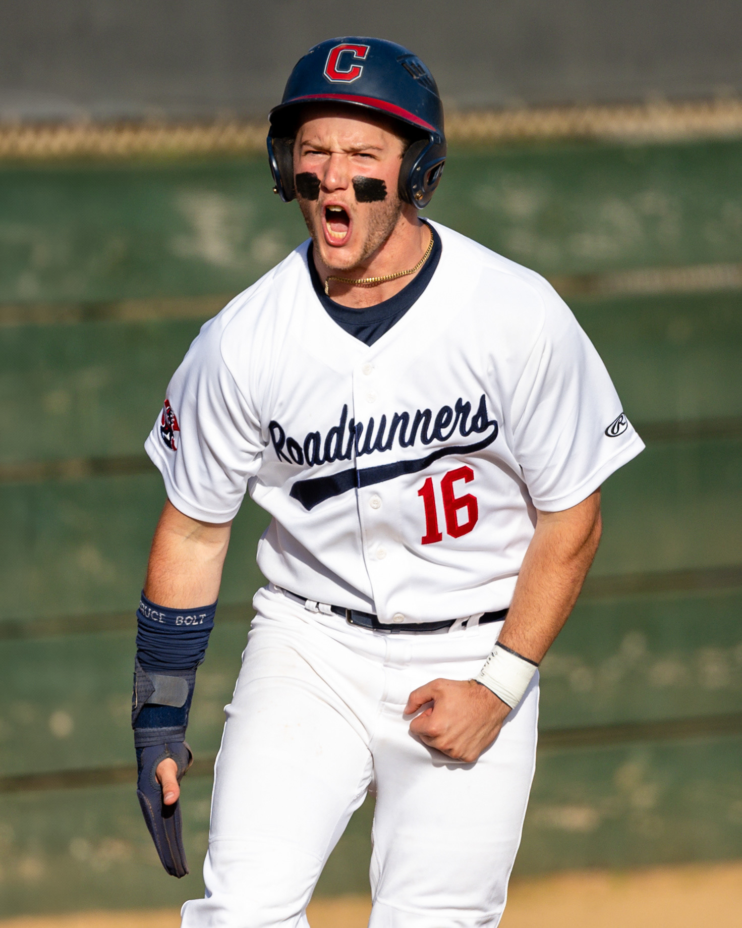 A high school baseball player for Crossroads celebrates a run during a CIF Southern Section Varsity Baseball Game in Santa Monica, CA