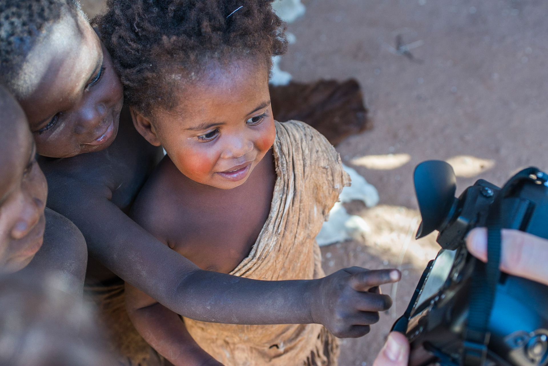 Kids of Demba tribe are participating in photography session