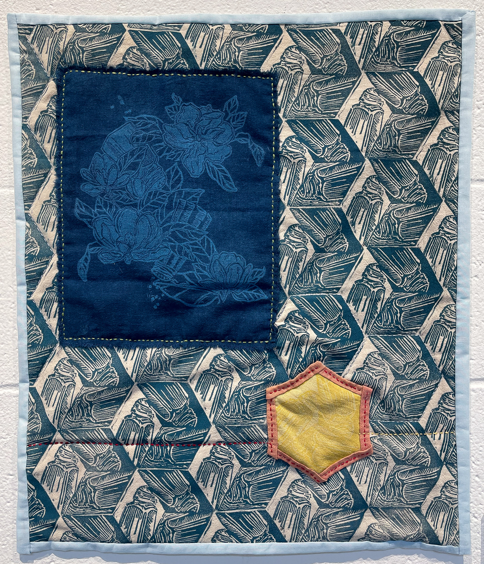 "Hiding in Plain Sight" (Relief print, indigo dye, marigold dye, found fabric, embroidery)