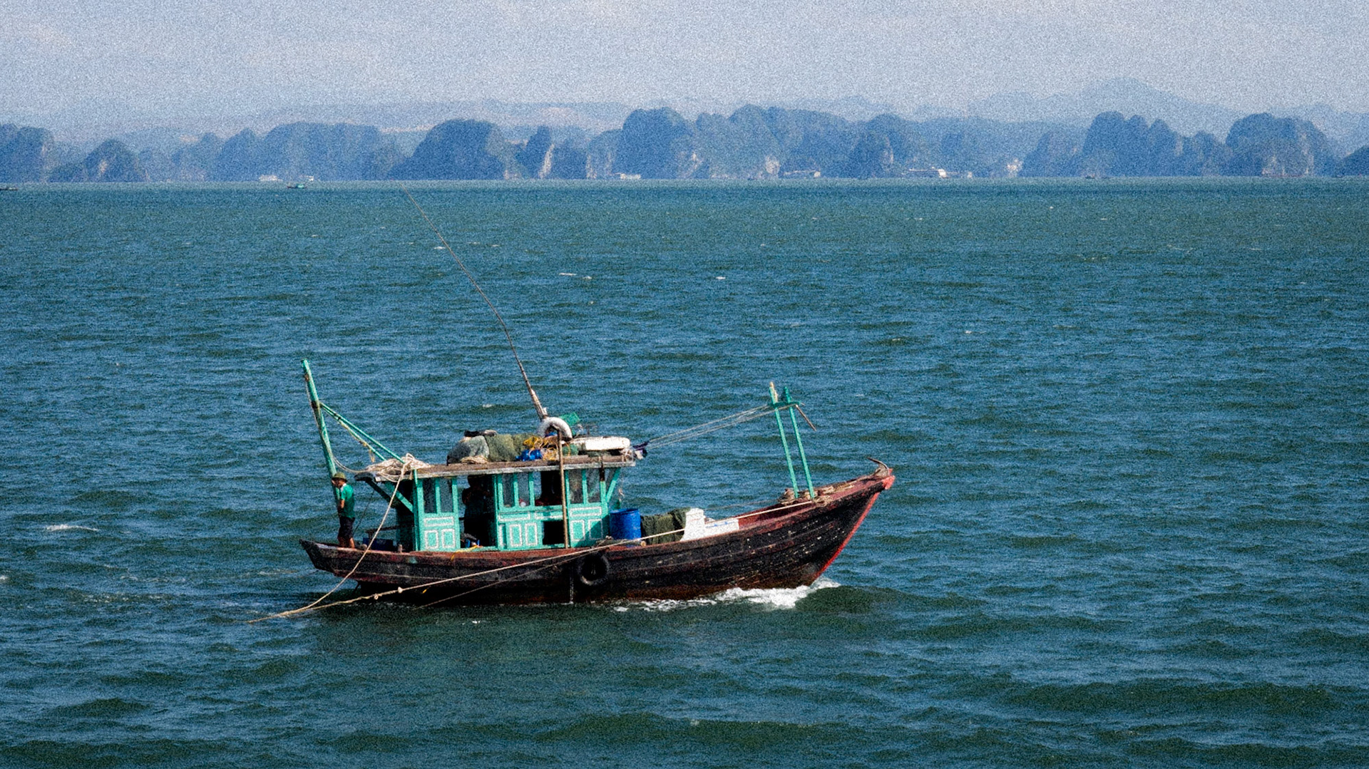 Passing boat - Ha Long Bay, Vietnam